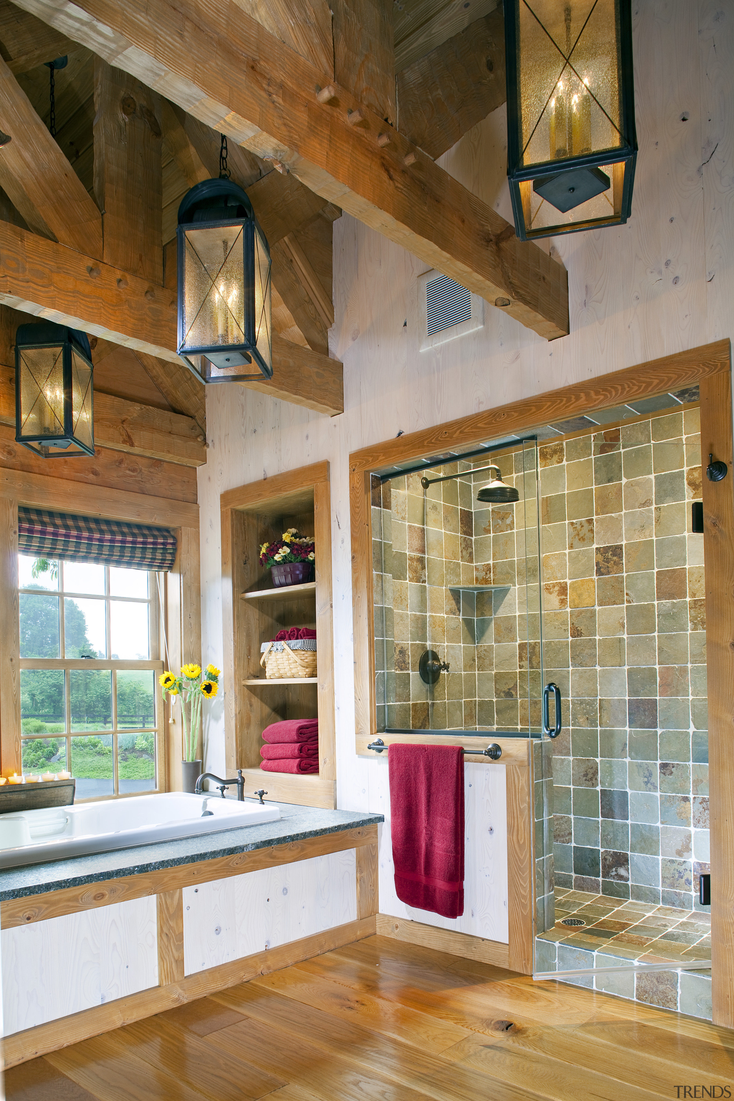 View of bathroom with stone shower and exposed beam, ceiling, countertop, daylighting, floor, flooring, home, interior design, living room, real estate, room, wall, wood, wood flooring, brown