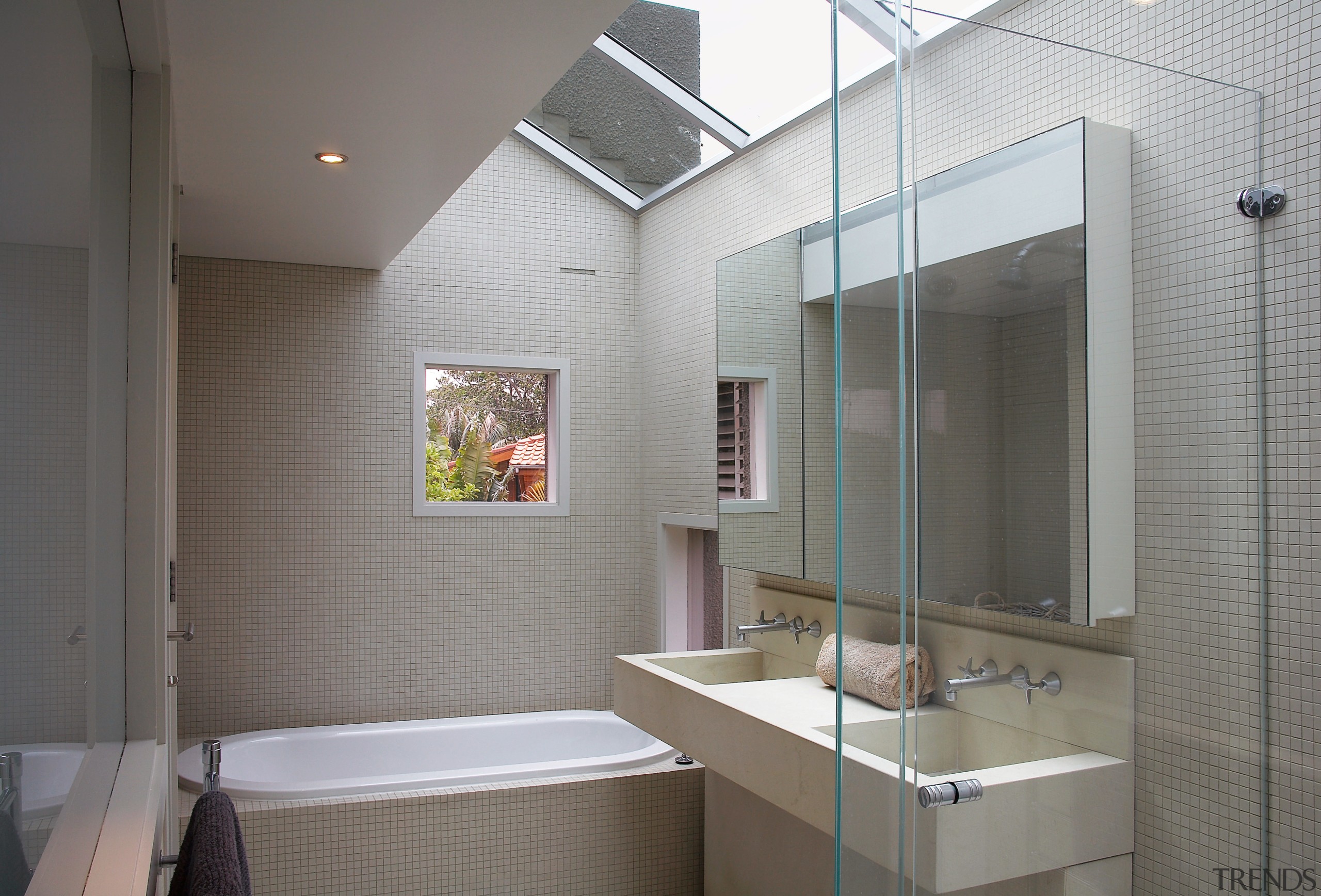 A view of the bathrom featuring tiled walls/flooring, architecture, bathroom, ceiling, daylighting, home, interior design, room, gray