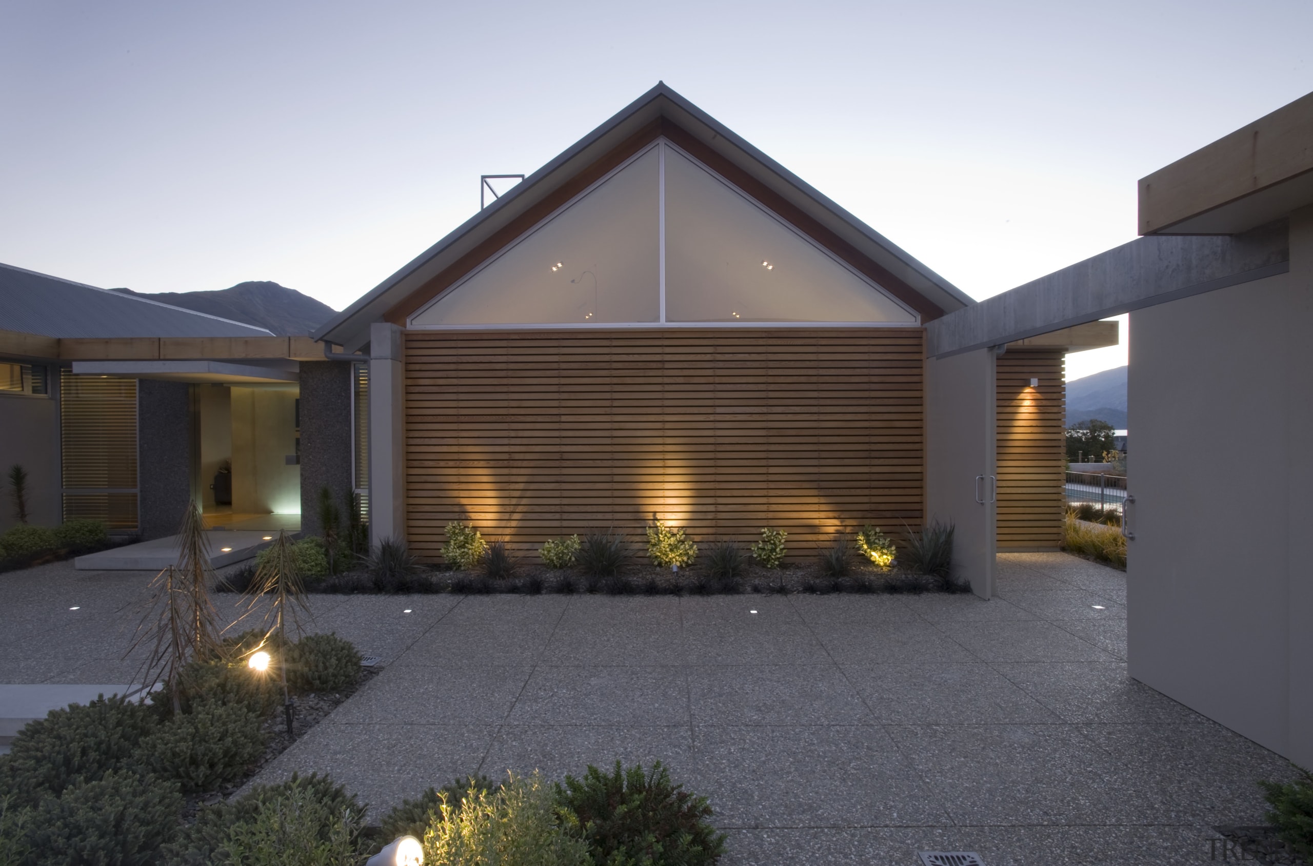 Exterior view of home with a gabled roof, architecture, backyard, estate, facade, home, house, lighting, property, real estate, residential area, roof, siding, window, gray, black