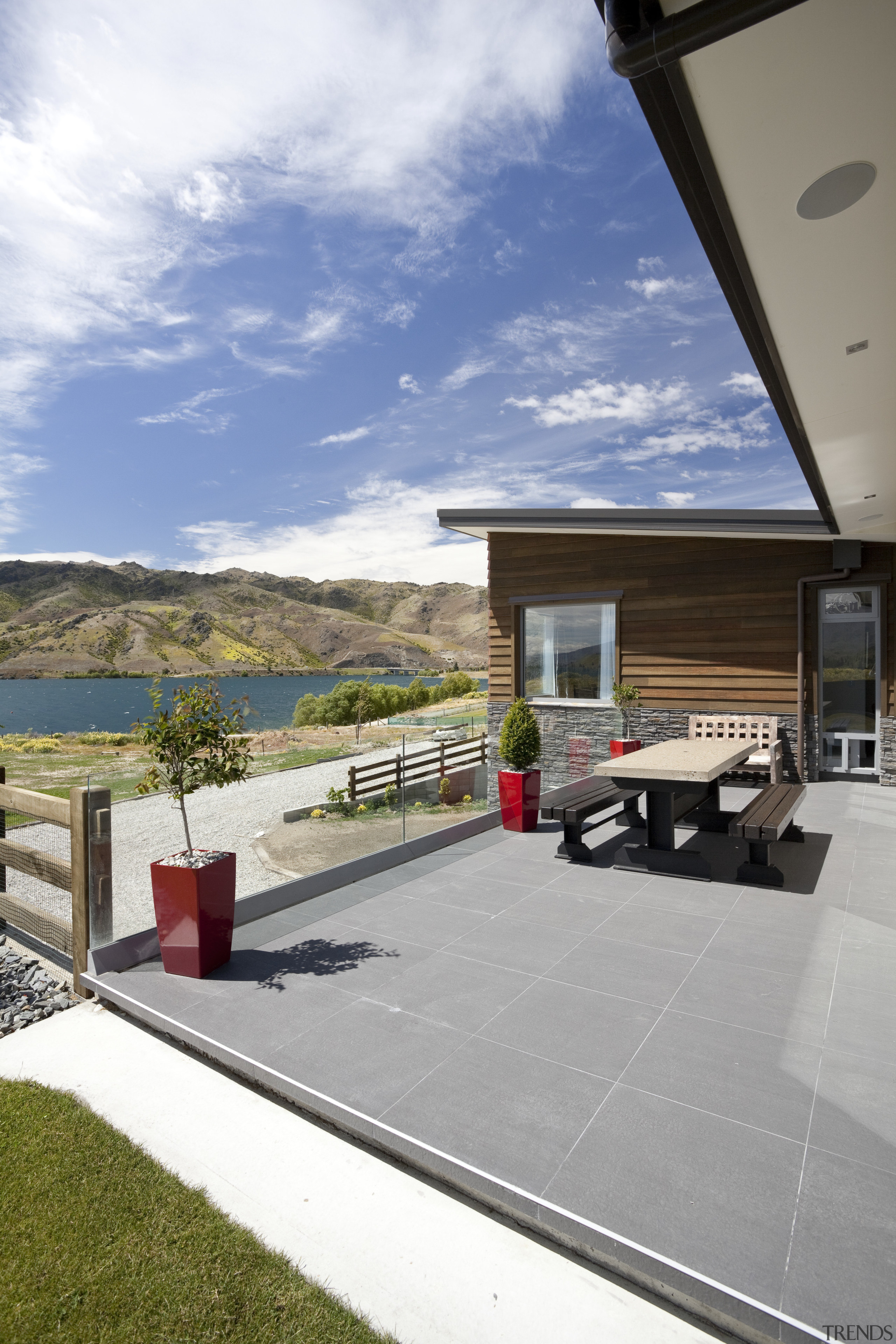 The flooring for this Otago home was chosen architecture, home, house, property, real estate, residential area, roof, sky, window, gray