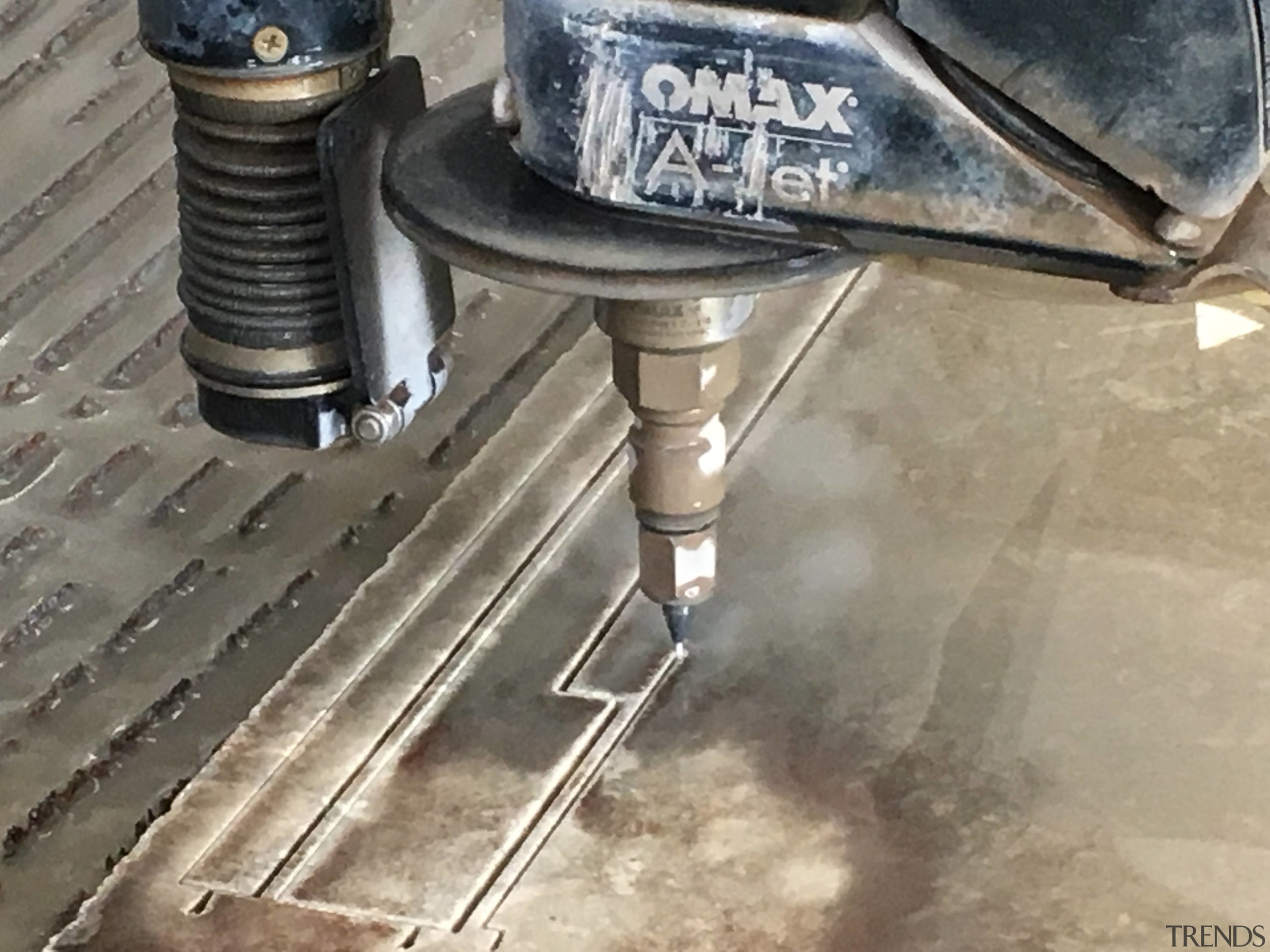The SCE Stone &amp; Design manufacturing team is auto part, automotive exterior, automotive tire, hardware, machine tool, metal, pipe, gray