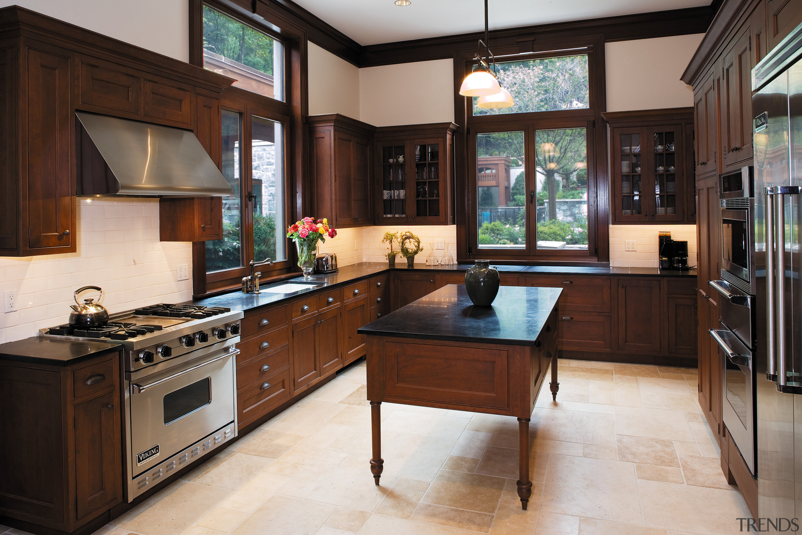 View of the kitchen featuring viking oven and cabinetry, countertop, cuisine classique, interior design, kitchen, room, black, gray