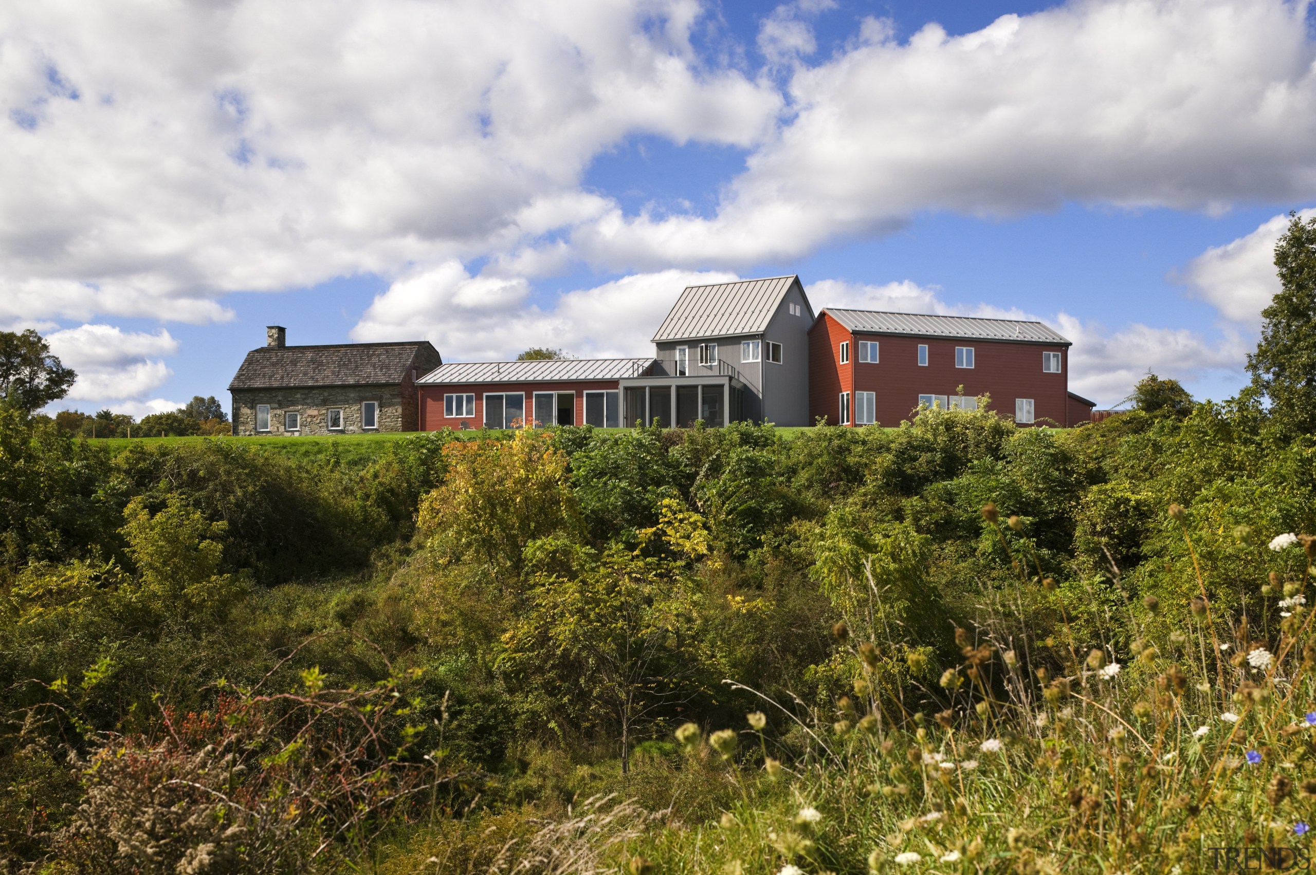 Architect Alexander Gorlin distilled the essence of a cloud, cottage, estate, farm, grass, home, house, land lot, plant, property, real estate, rural area, sky, tree, brown