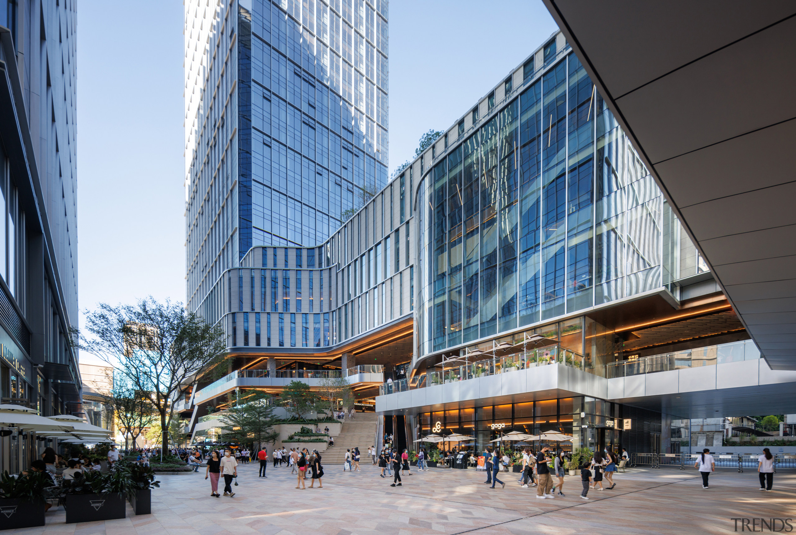 Office towers rise above the food and retail 