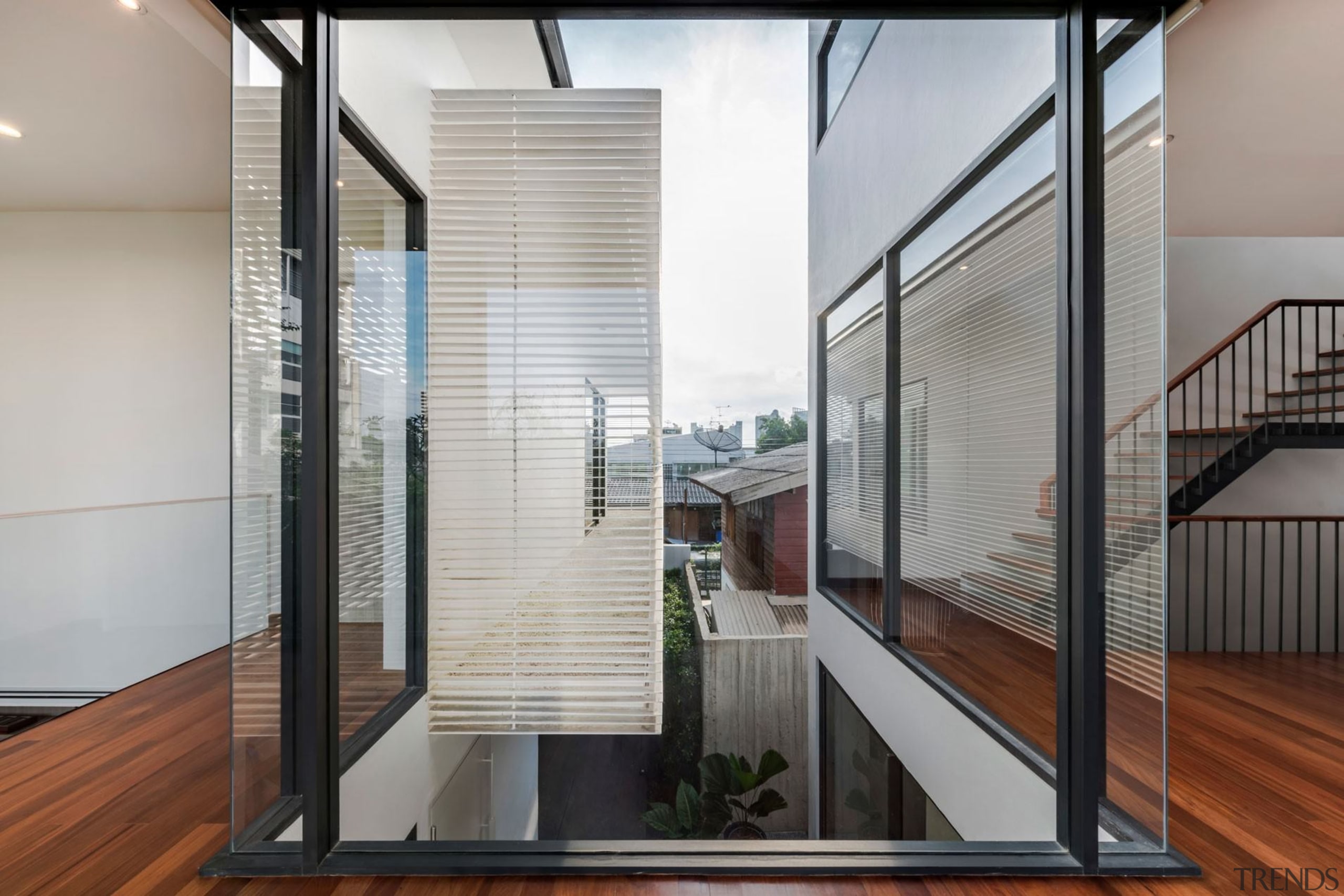 Expansive, wraparound glass means light and views into architecture, building, condominium, daylighting, door, glass, handrail, house, interior design, property, real estate, stairs, window, gray