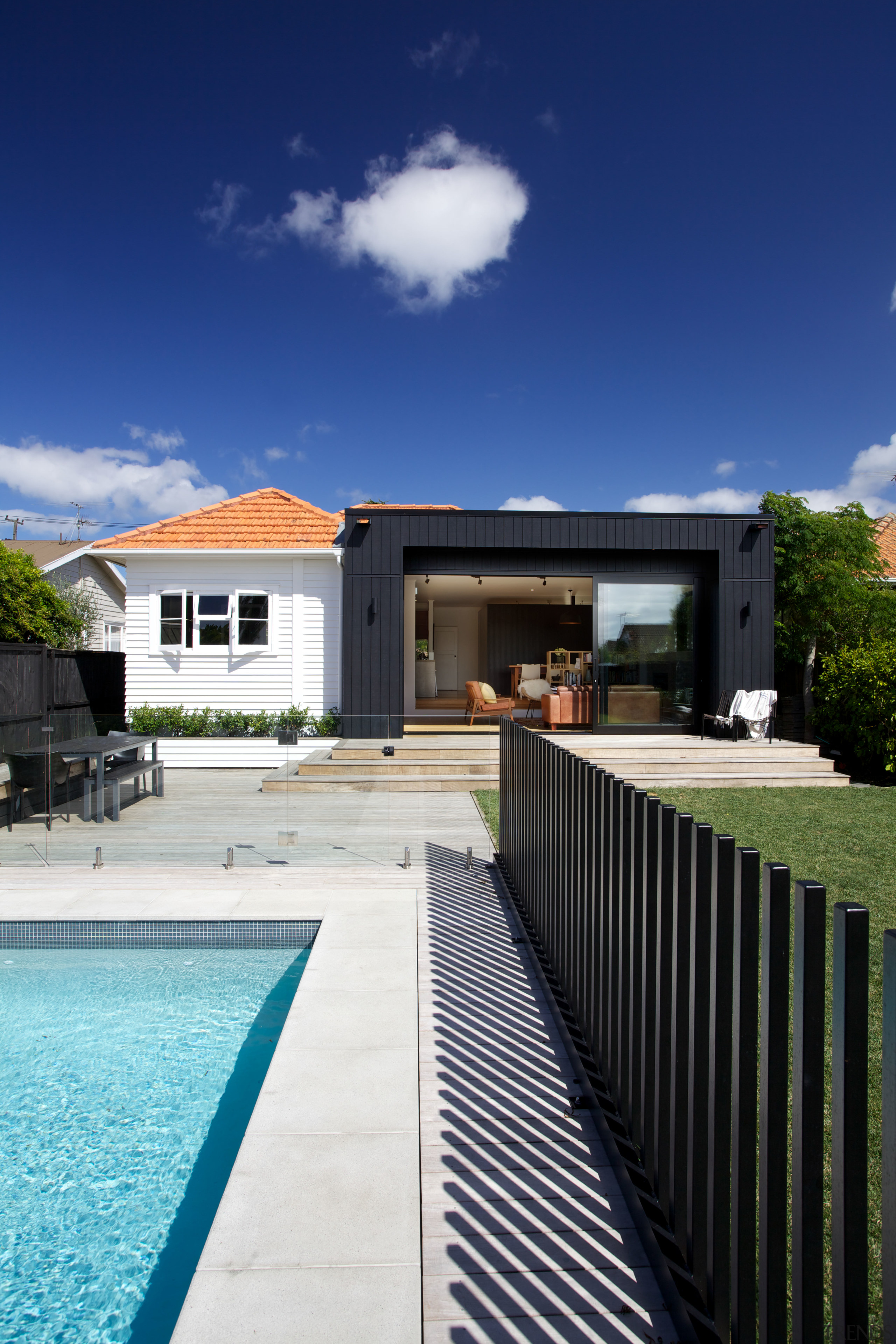 Contemporary black box addition to older home the architecture, backyard, cloud, estate, facade, home, house, property, real estate, reflection, residential area, sky, swimming pool, villa, water, blue