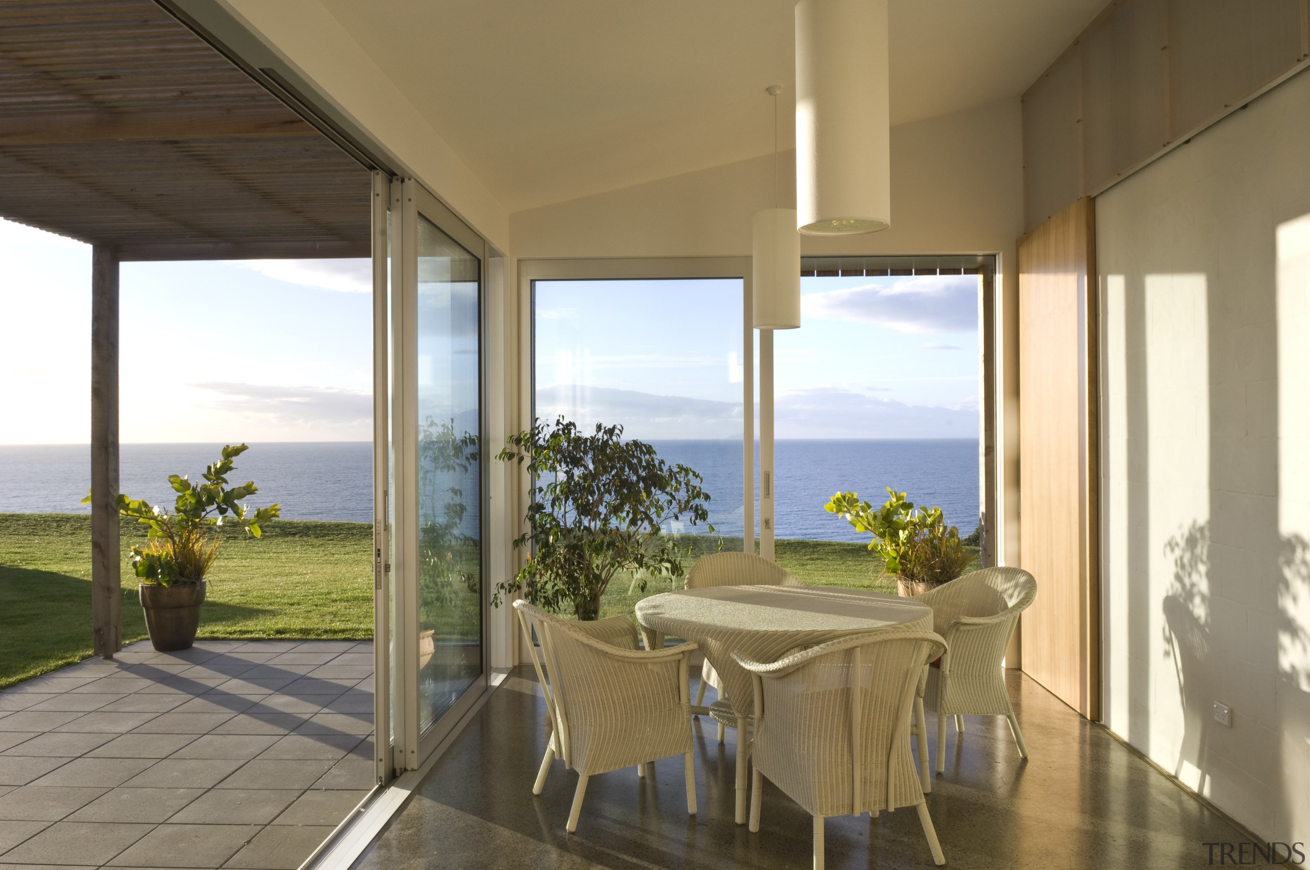 View of the sunroom which features glass sliding apartment, door, estate, home, house, interior design, property, real estate, window, brown