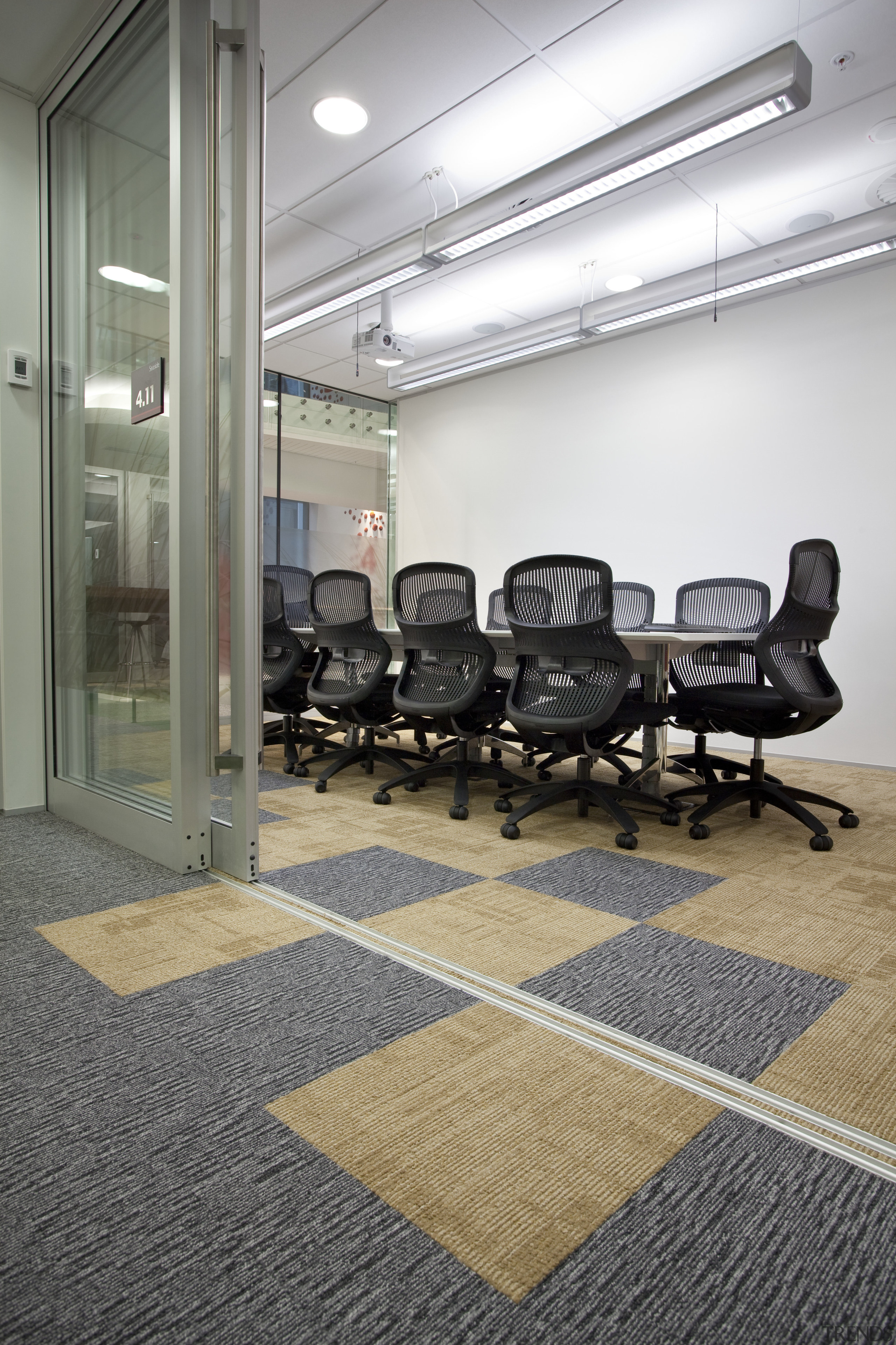 View of contemporary carpet tiles with checkerboard design. floor, flooring, interior design, office, tile, gray, white