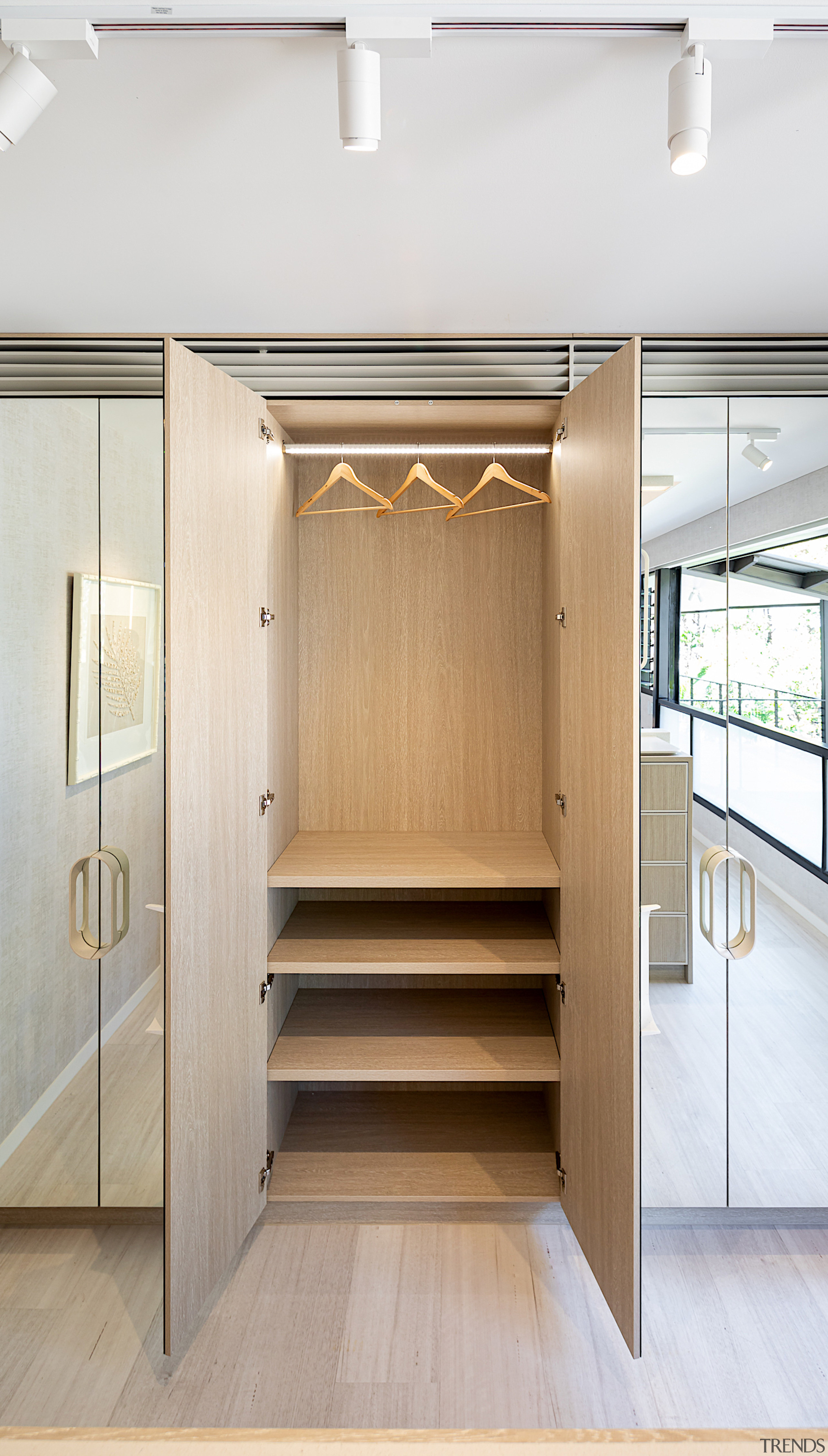 The fully mirrored robe doors create the illusion 