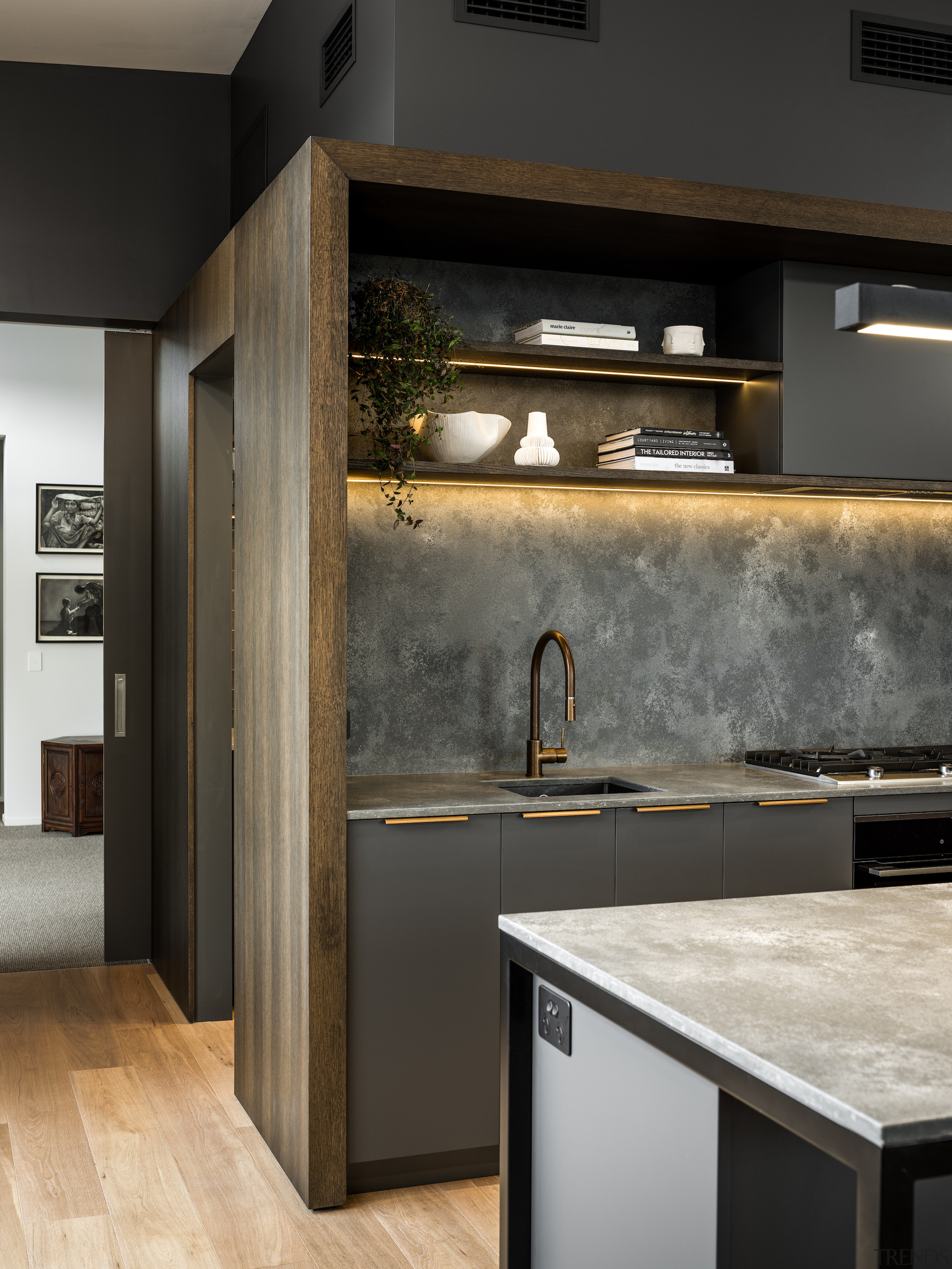 A concrete look benchtop and splashback add to 