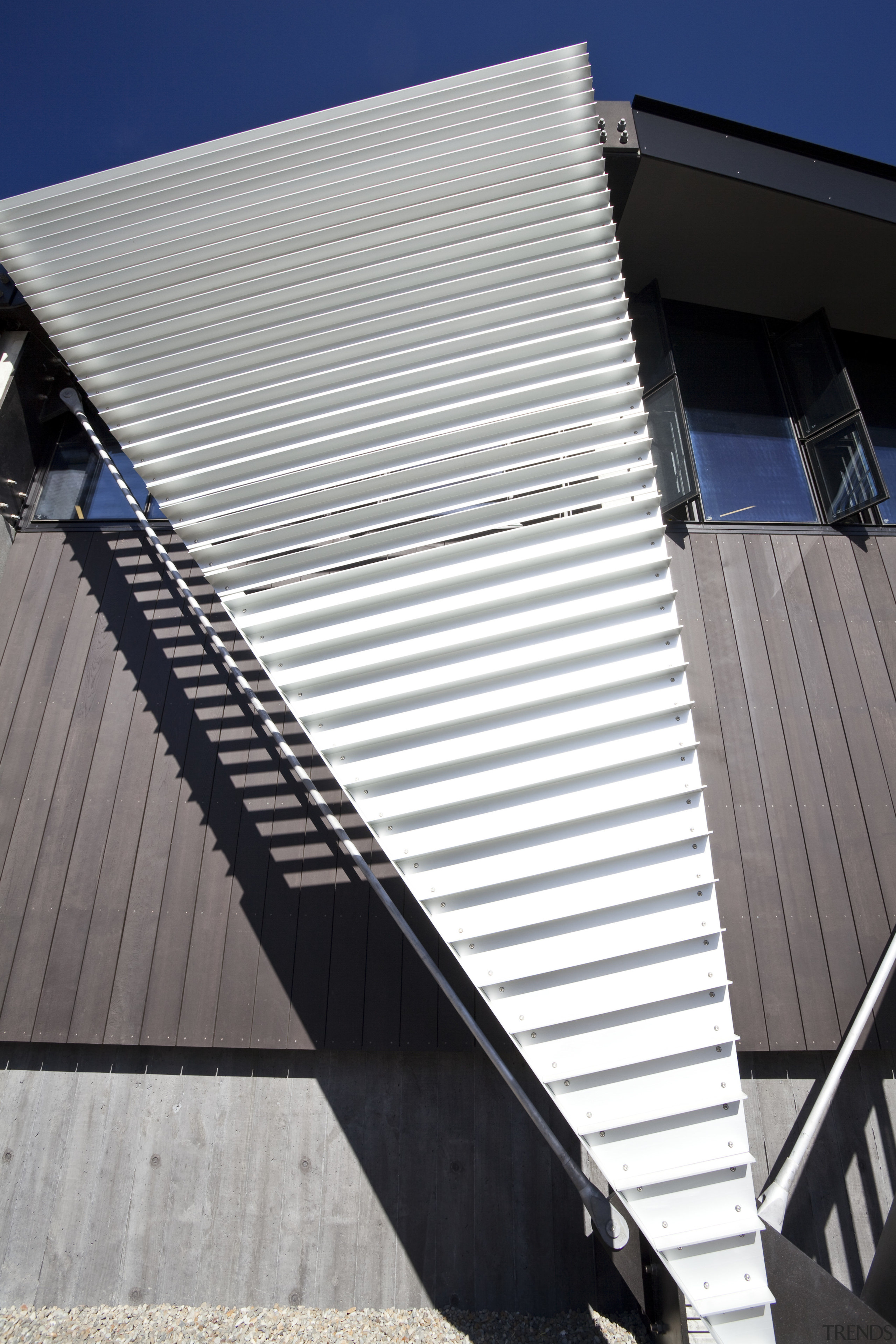 View of folded roof and canopy design at angle, architecture, building, commercial building, daylighting, daytime, facade, house, line, roof, sky, structure, window, gray