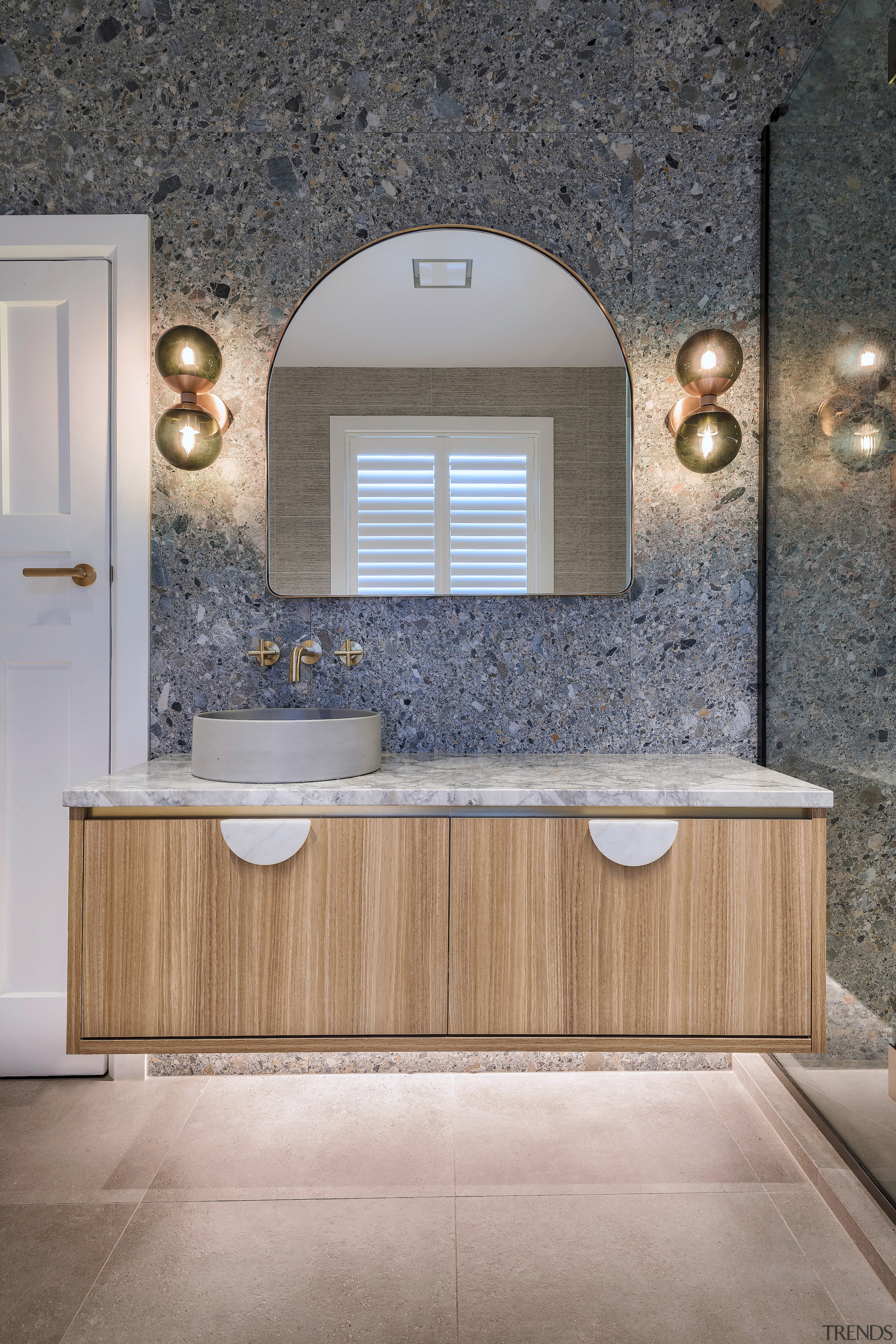 Marble vanity handles connect with the marble benchtop. 