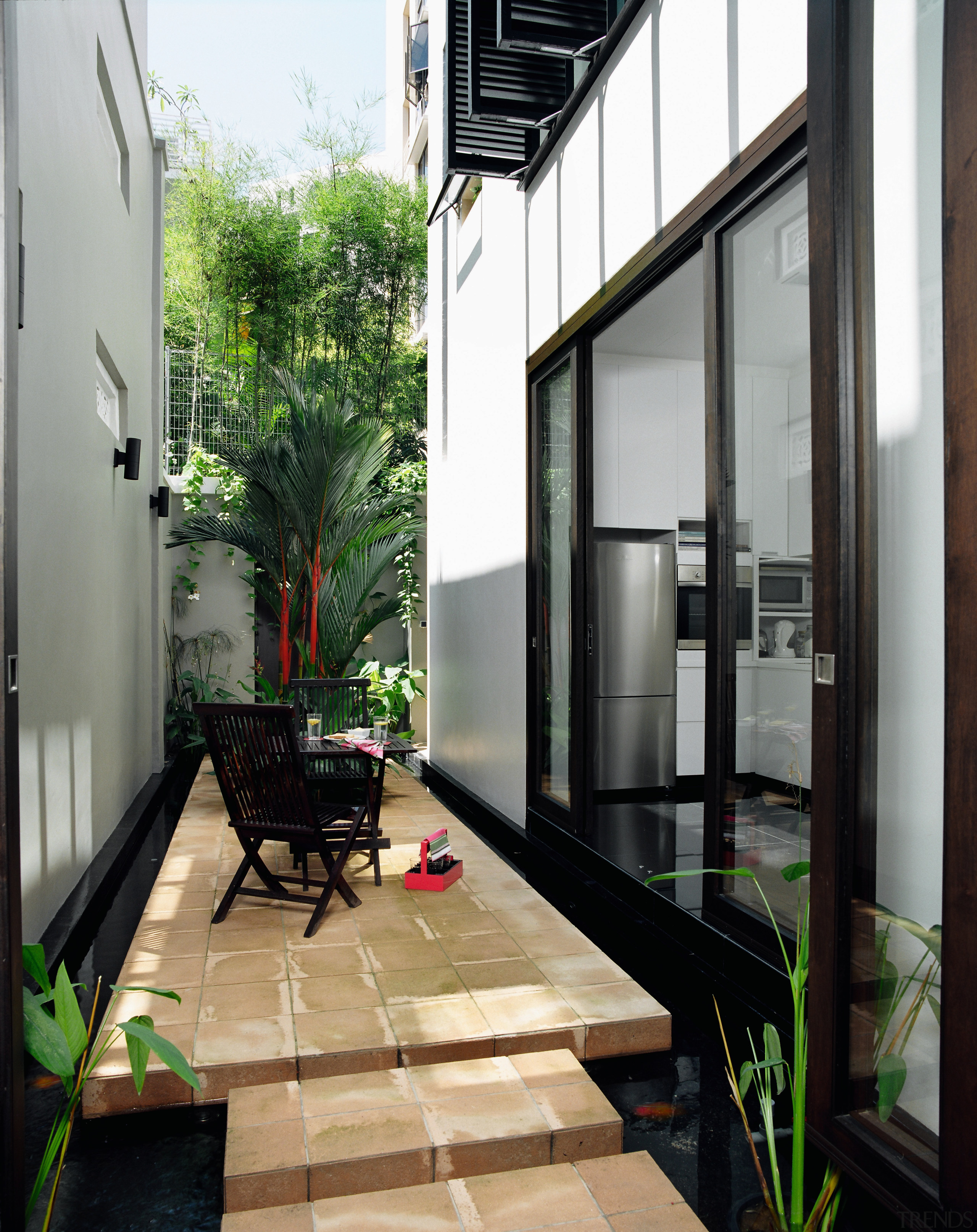 The living and dining area and kitchen open architecture, balcony, condominium, courtyard, door, home, house, interior design, patio, property, real estate, window, black, gray