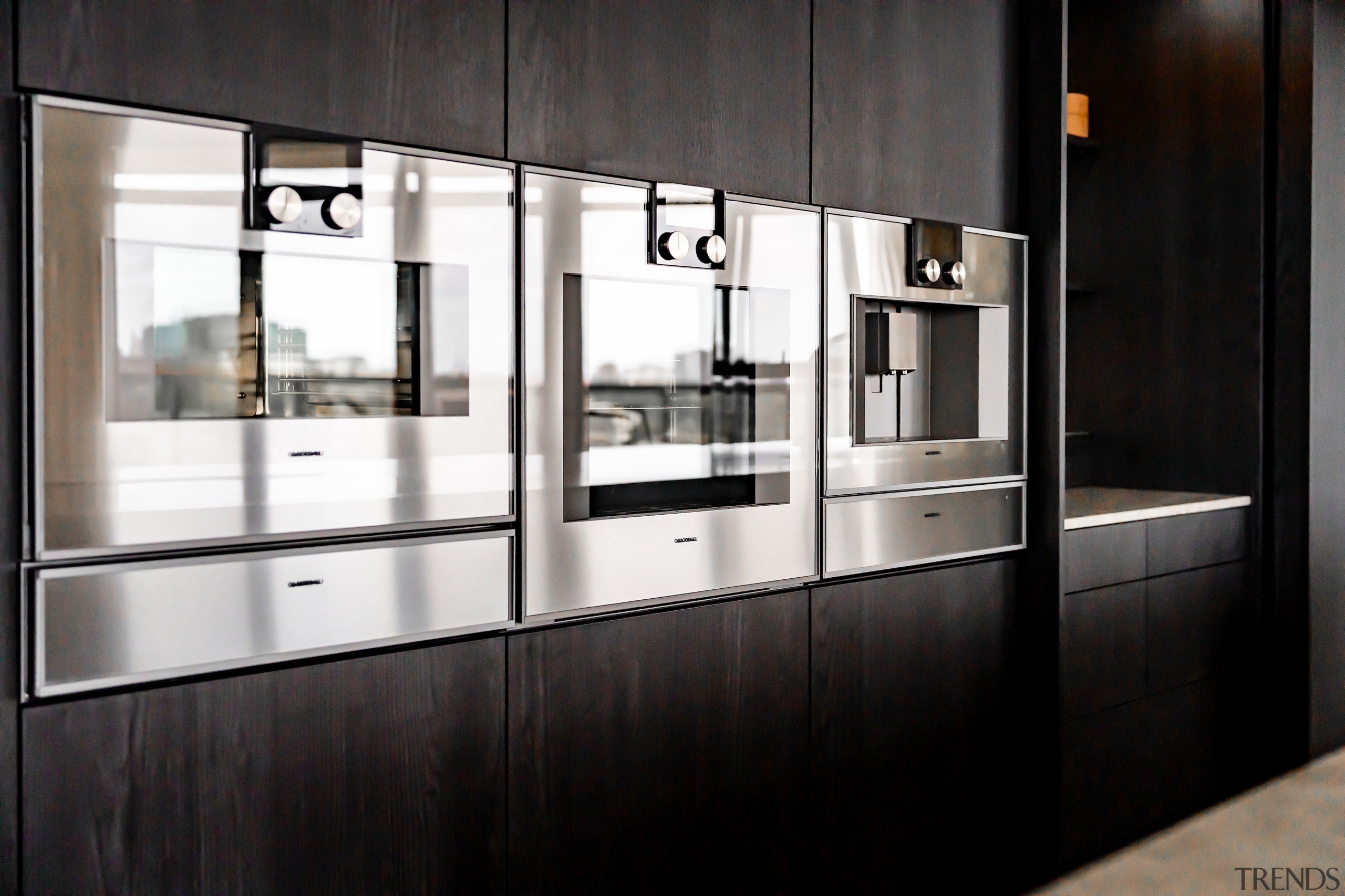 Gleaming Gaggenau ovens all in a row. - 