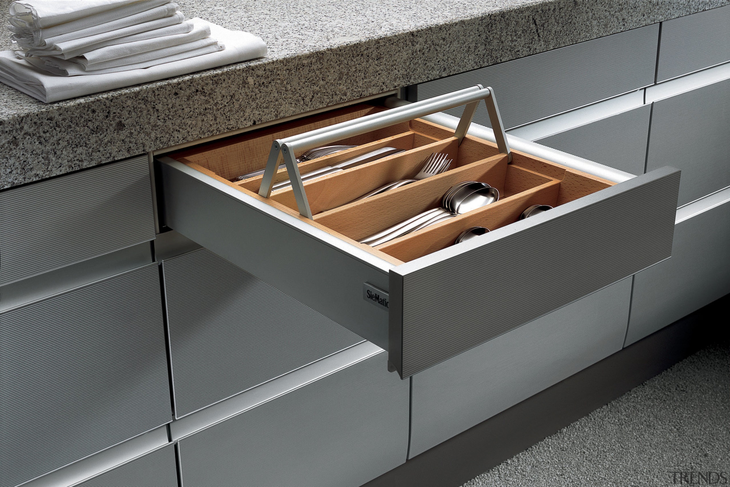 View of kitchen which features innovative storage solutions countertop, drawer, floor, furniture, product, product design, sink, gray, black