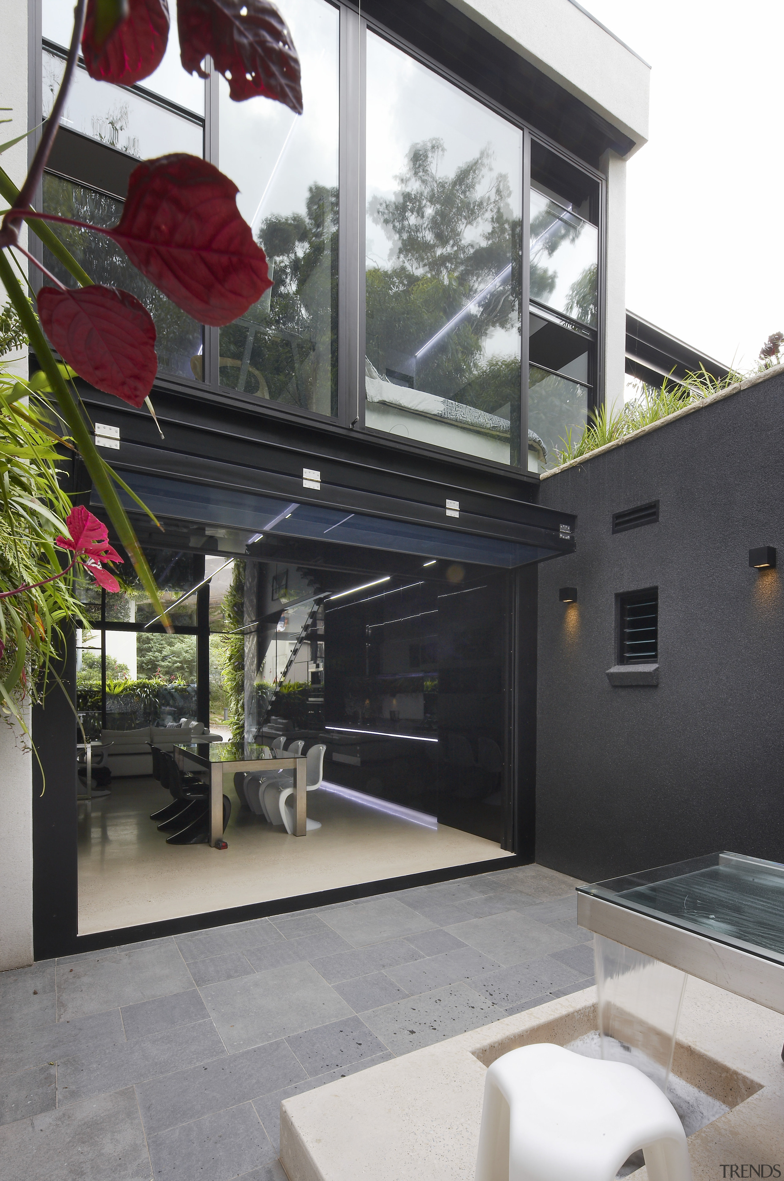 The glass door at the rear of this architecture, building, house, window, black, white, gray