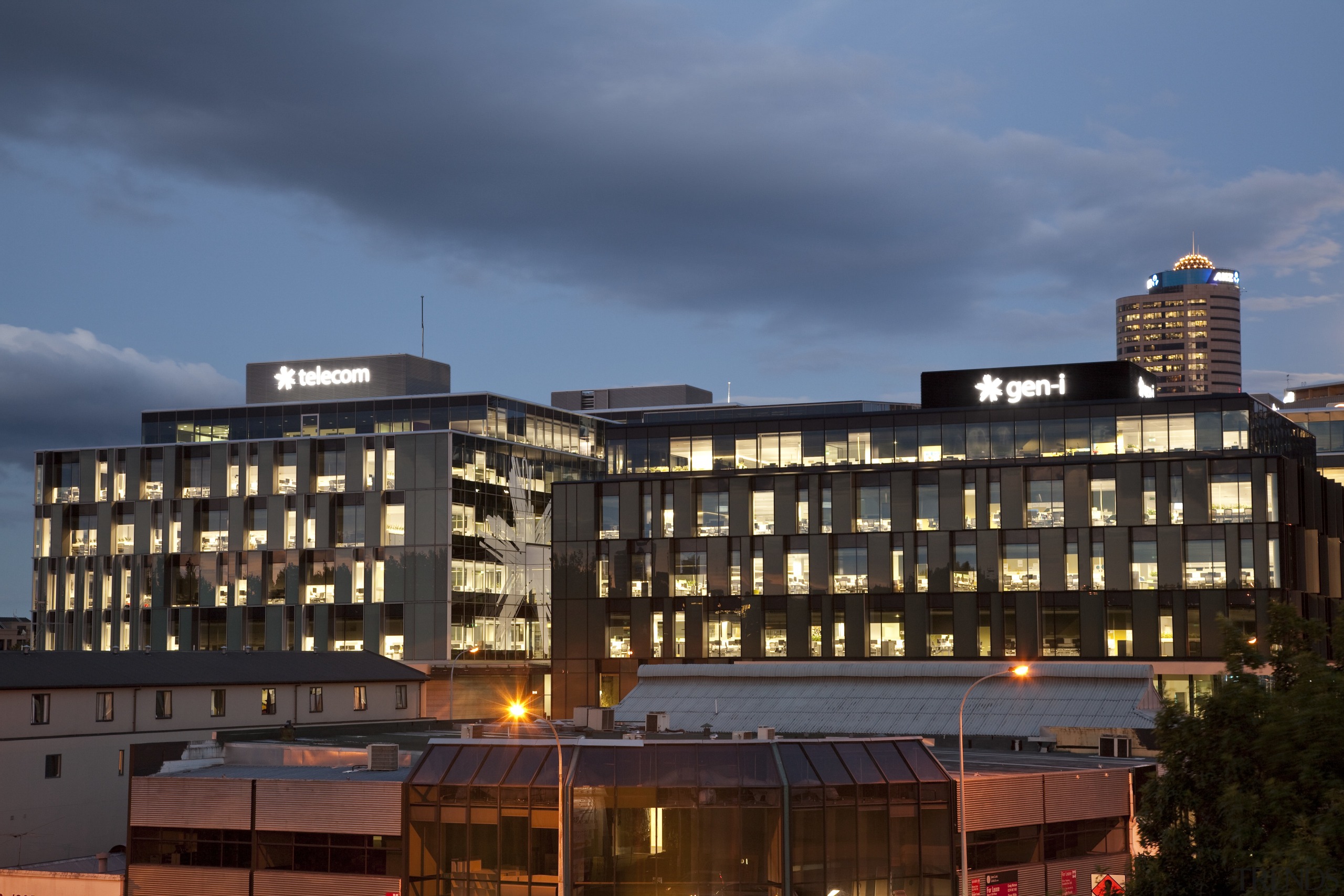 View of the Telecom Auckland head office, spread apartment, architecture, building, city, cityscape, condominium, corporate headquarters, downtown, dusk, evening, facade, home, hotel, metropolis, metropolitan area, mixed use, neighbourhood, night, real estate, residential area, sky, skyline, skyscraper, suburb, tower block, urban area, blue, black