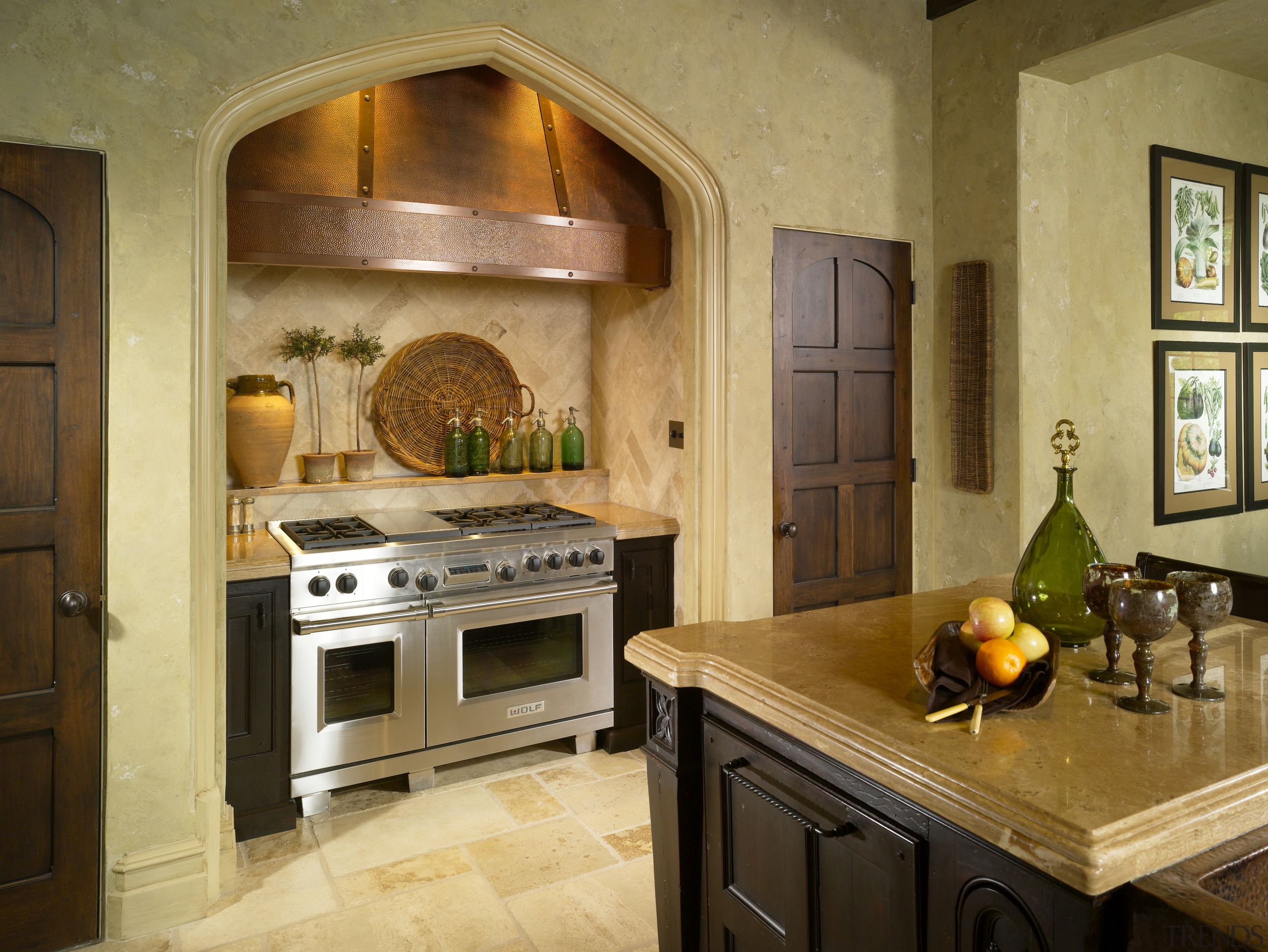 View of traditionally styled kitchen with Tudor-style arch, cabinetry, countertop, cuisine classique, interior design, kitchen, room, brown, orange