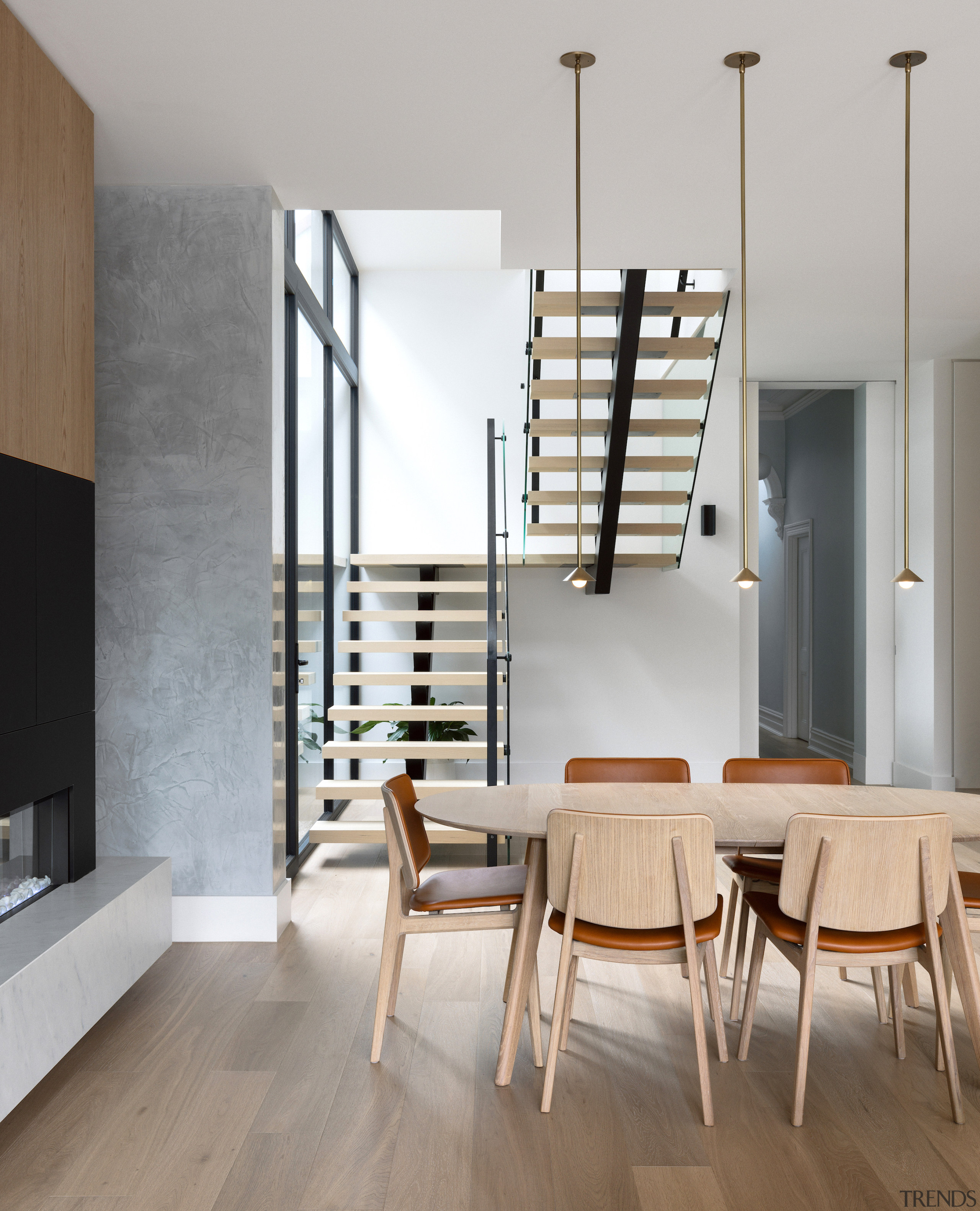 New central dining area beside contemporary fireplace. 