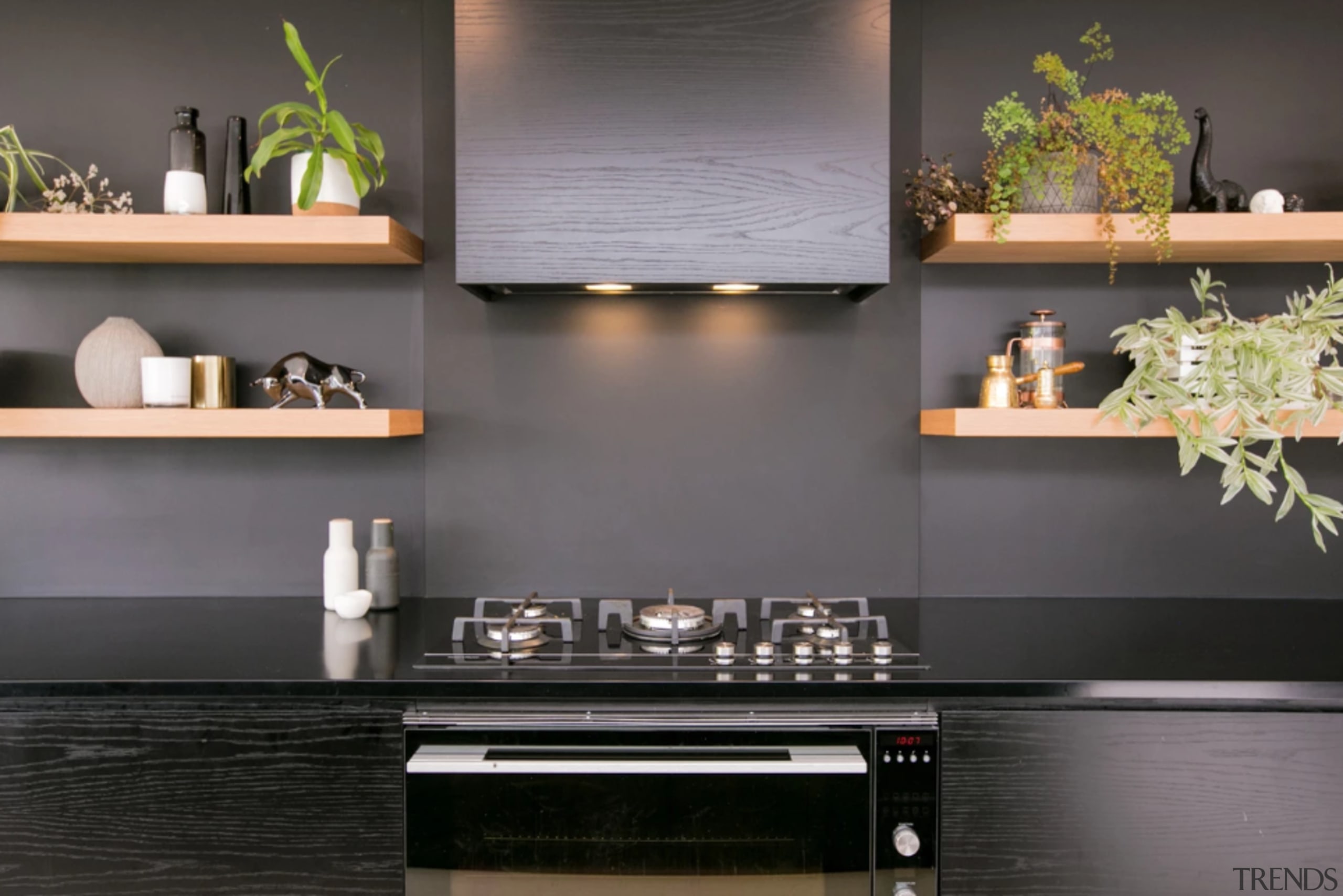 Bold kitchen features Fisher & Paykel appliances - cabinetry, countertop, floor, flooring, furniture, interior design, kitchen, kitchen stove, living room, material property, room, shelf, stove, table, tile, wall, gray, black