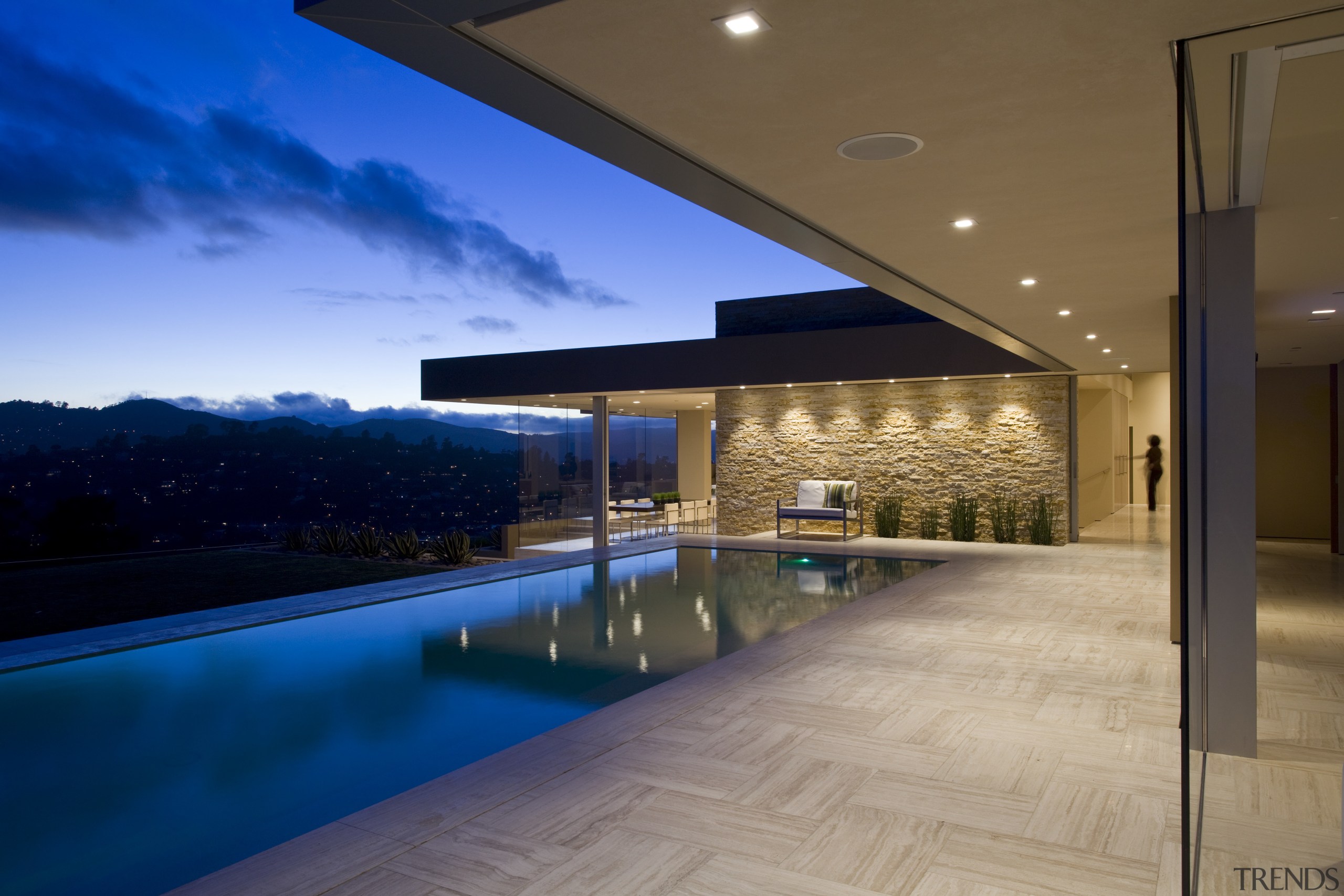 This house was remodeled by Robert Swatt of apartment, architecture, condominium, daylighting, estate, home, house, interior design, lighting, property, real estate, reflection, sky, swimming pool, blue, brown