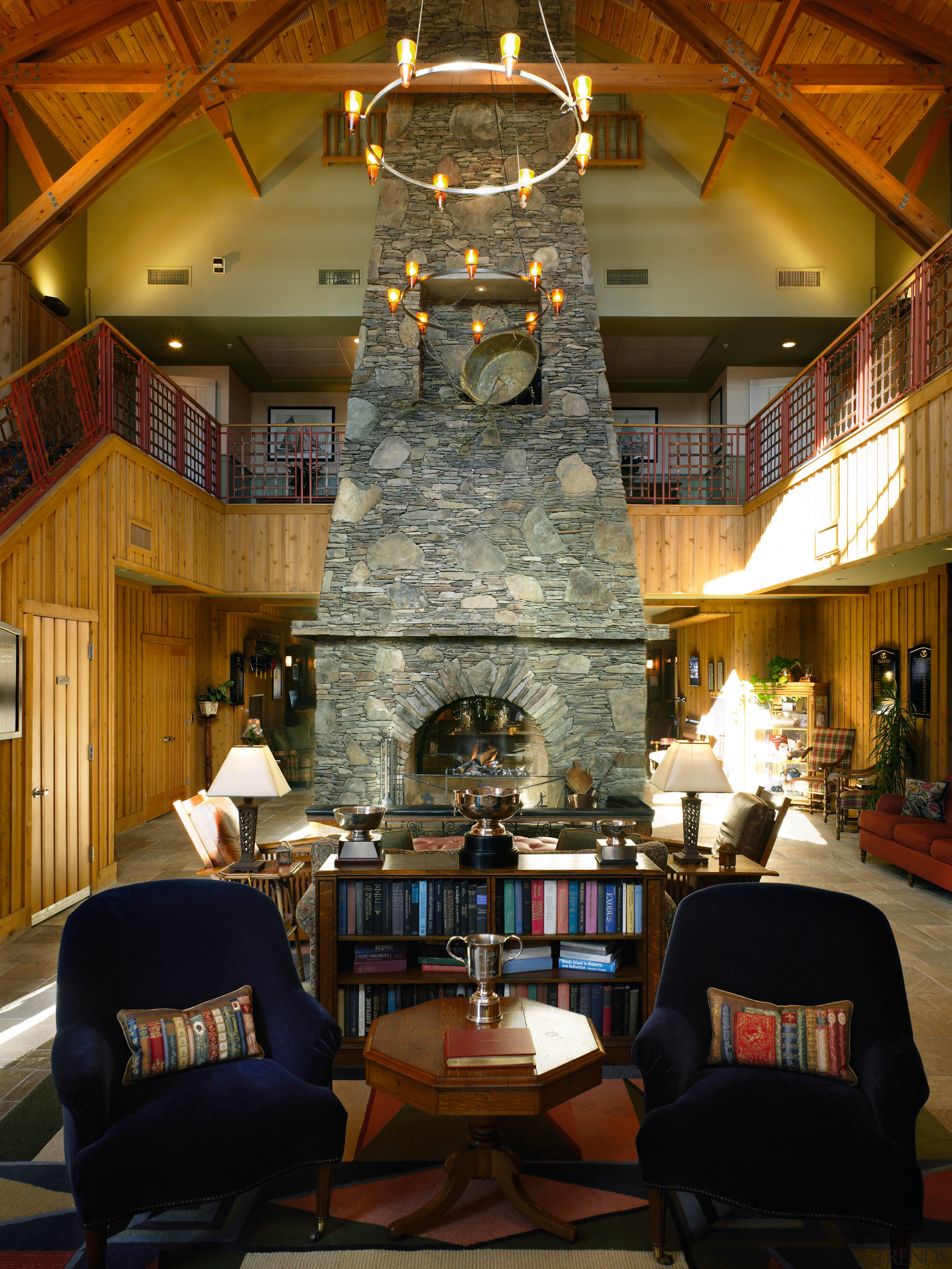 Large hall room with tall stone chimney feature, home, interior design, living room, lobby, room, brown