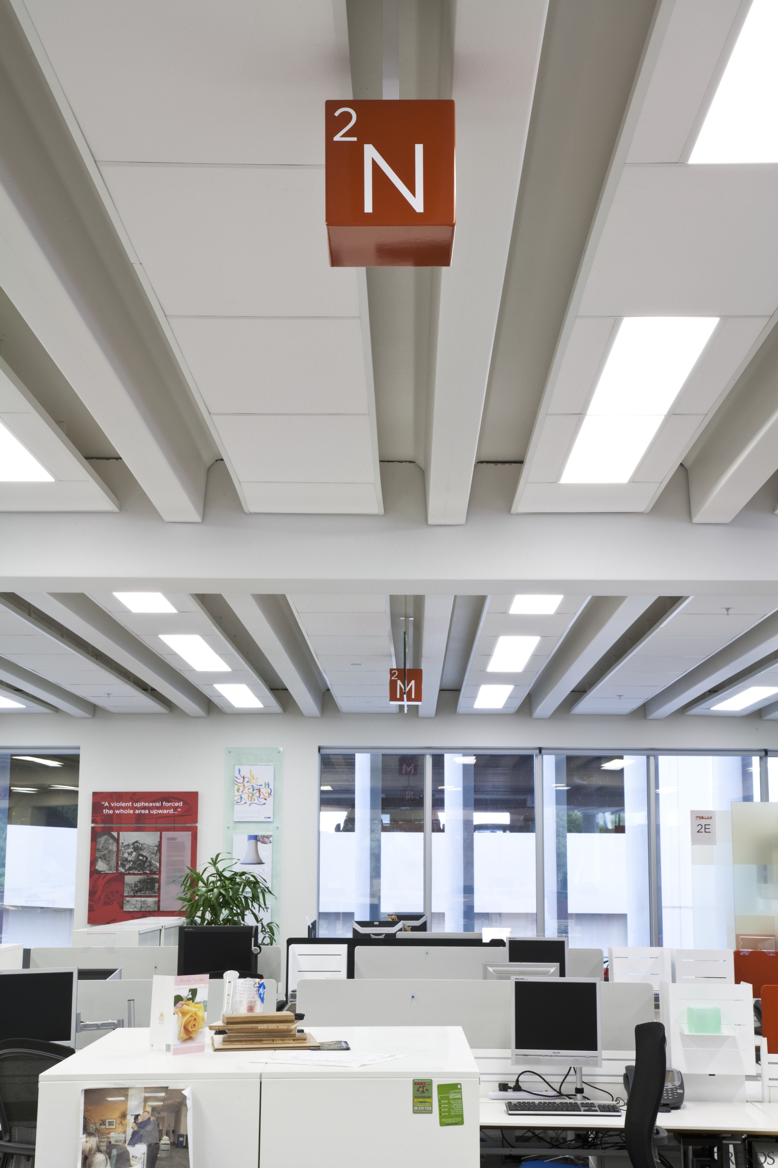 Rocket Signs developed and installed signage in the ceiling, daylighting, interior design, office, gray, white