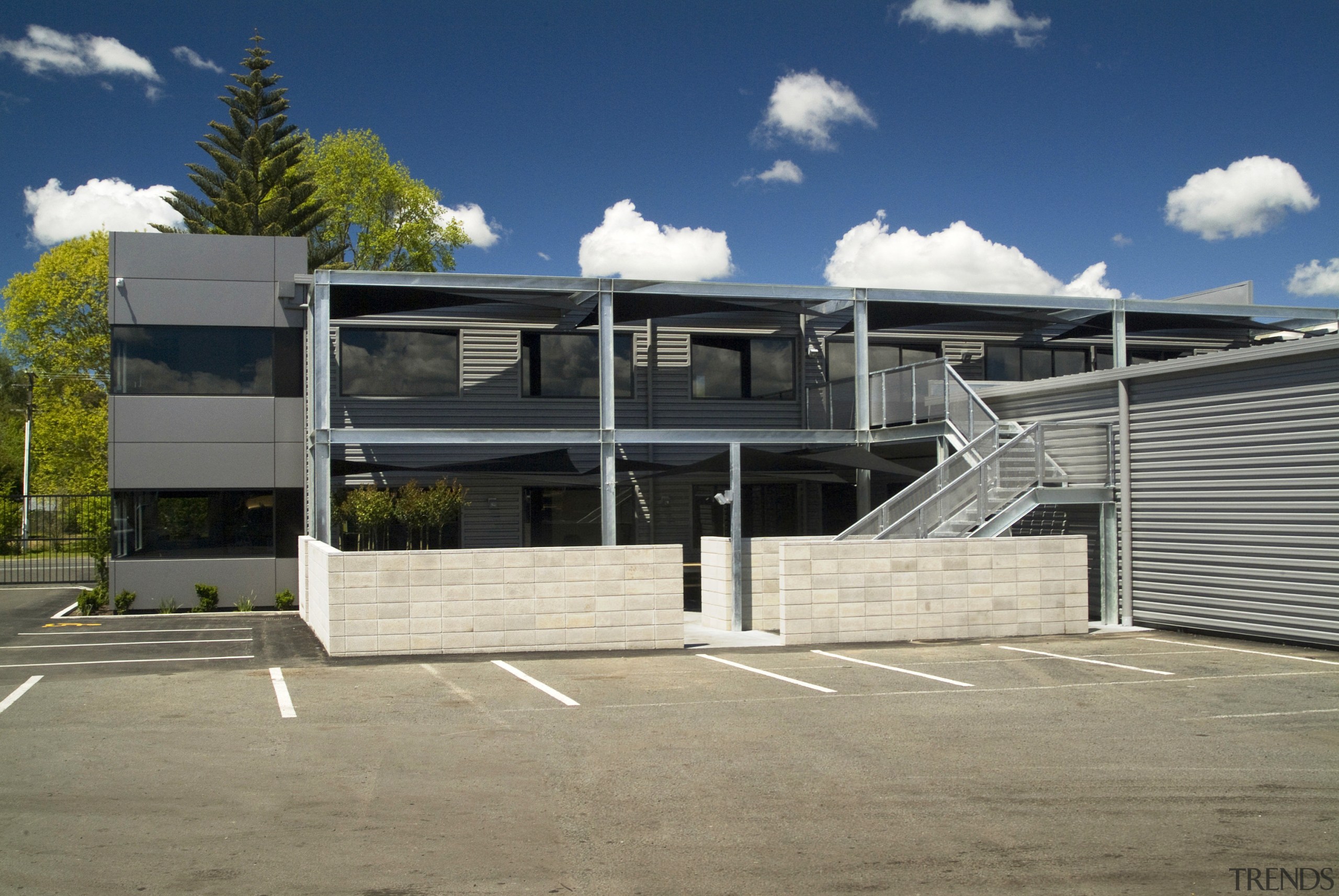 View of the courtyard area which also has architecture, building, commercial building, corporate headquarters, elevation, facade, house, property, real estate, residential area, roof, structure, brown, gray