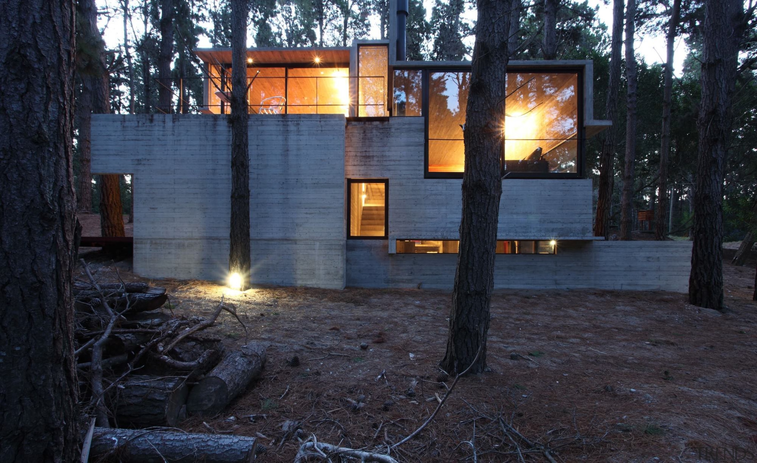 Substantial windows provide views out to the forest home, house, lighting, real estate, tree, black