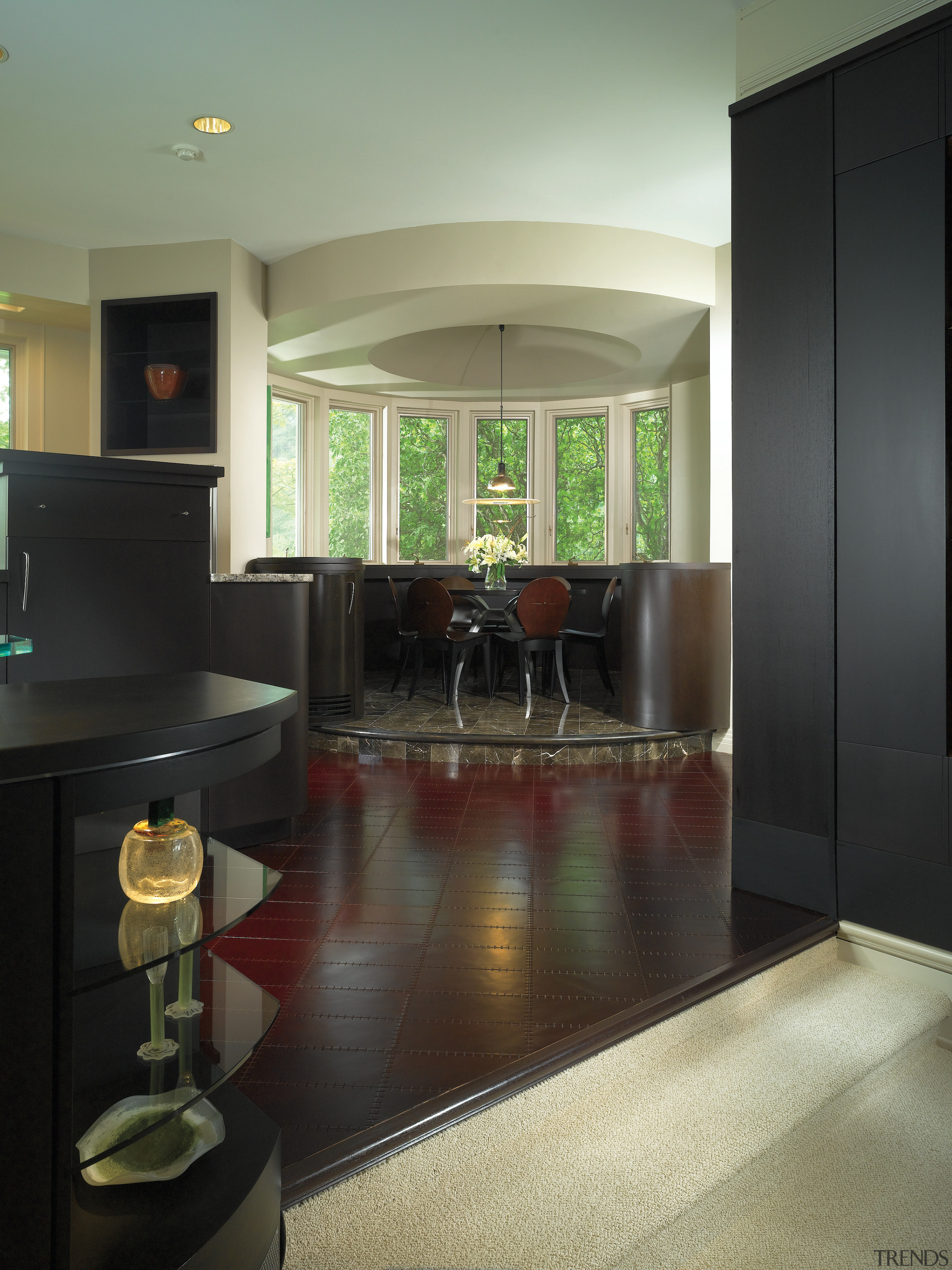 A view of the kitchen area, wooden cabinetry, architecture, ceiling, countertop, floor, flooring, hardwood, home, interior design, kitchen, living room, lobby, real estate, room, wall, wood flooring, black