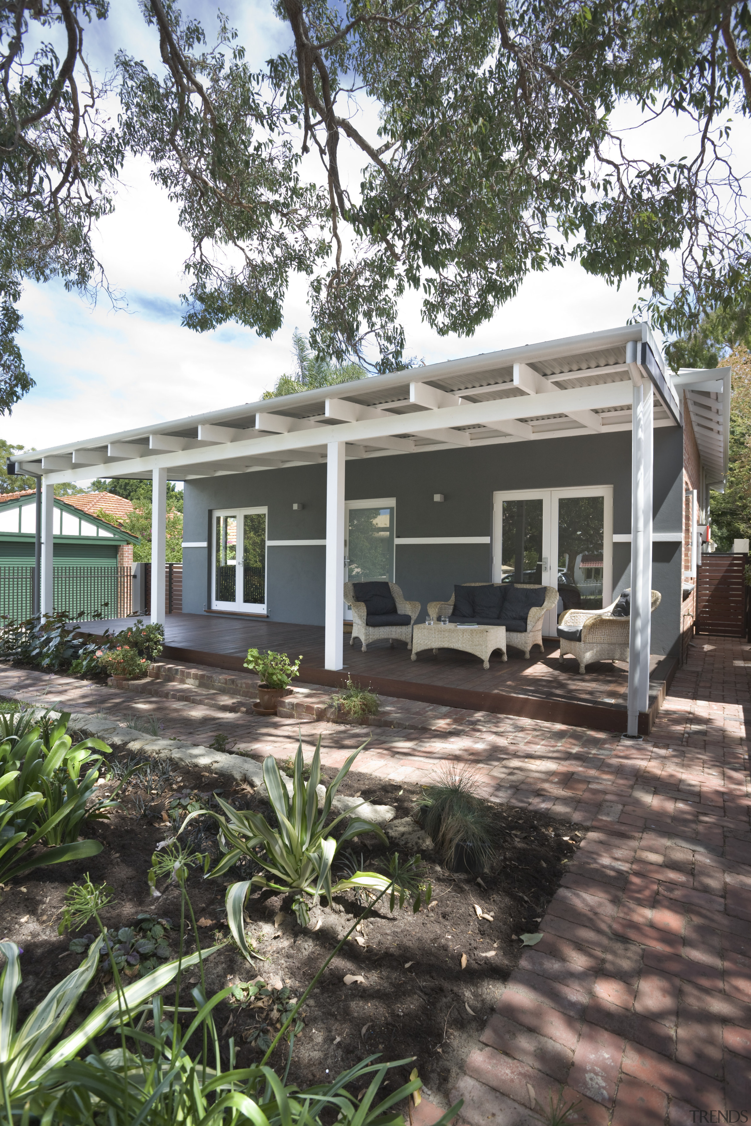 Exterior view of this patio - Exterior view backyard, cottage, home, house, outdoor structure, property, real estate, siding, tree, black, white