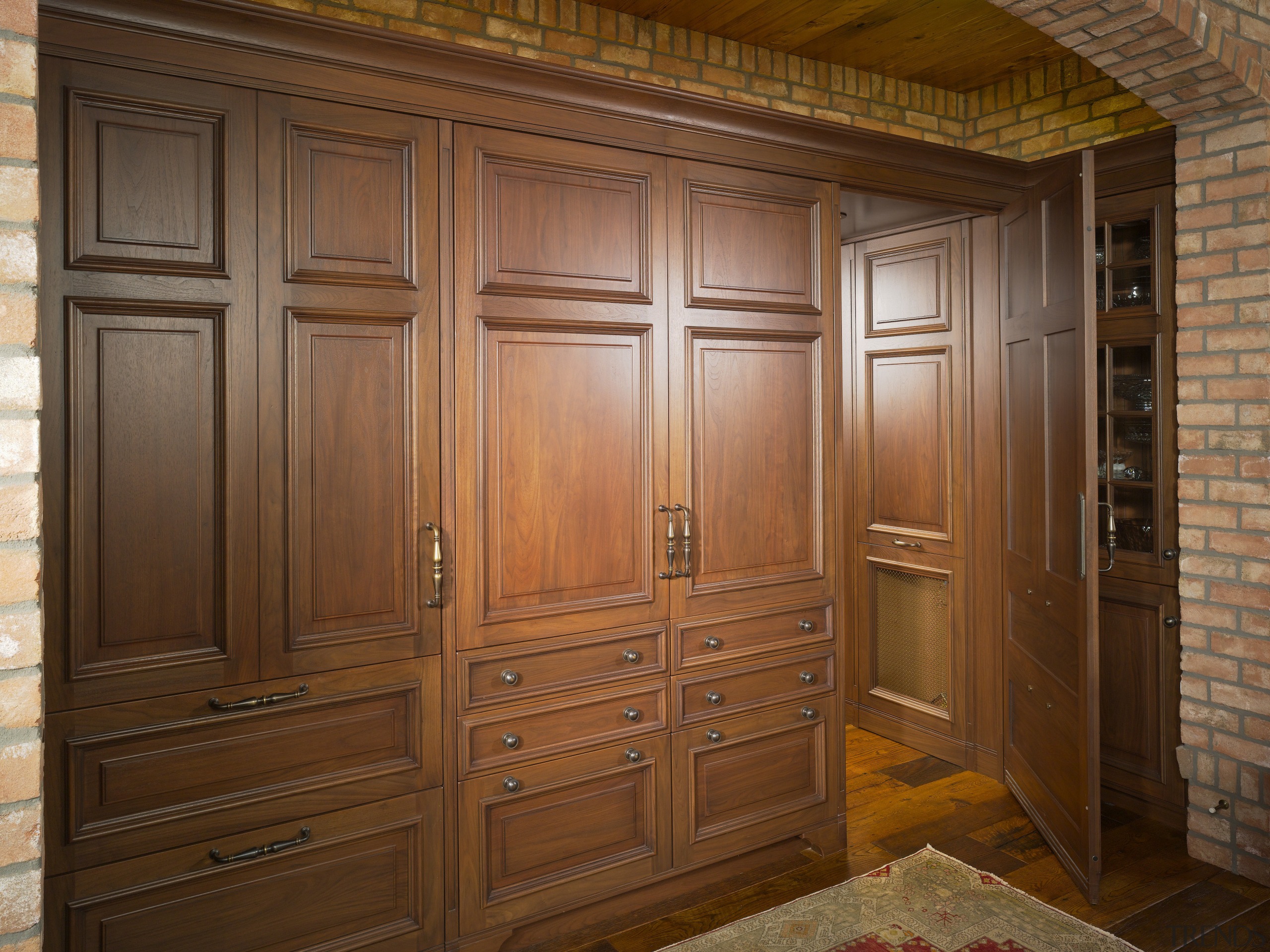 the wooden storage cuboards open to reveal access cabinetry, closet, cupboard, door, furniture, hardwood, wall, wardrobe, wood, wood stain, brown