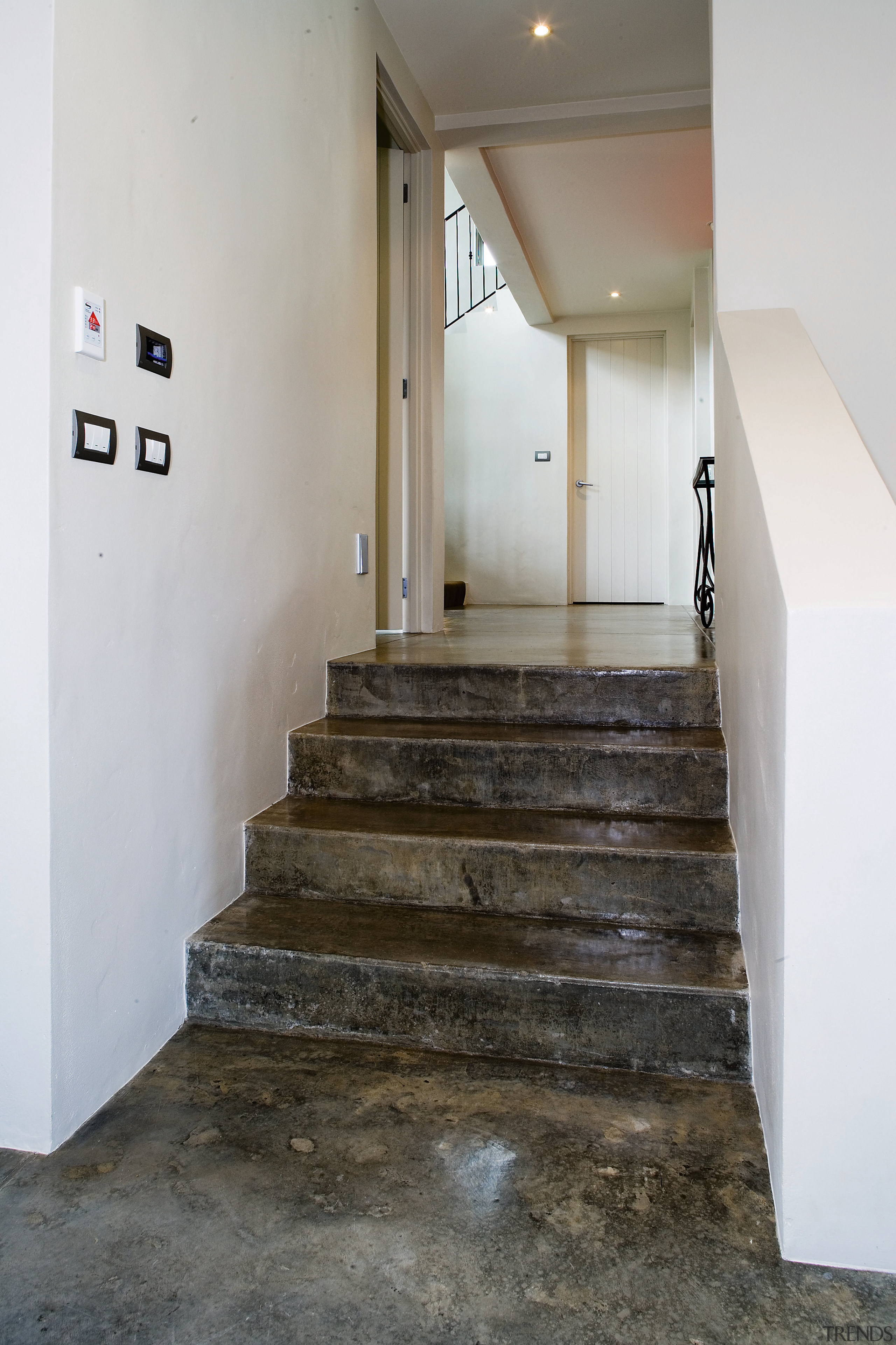 A view of some coloured concrete flooring from architecture, floor, flooring, handrail, stairs, gray, white