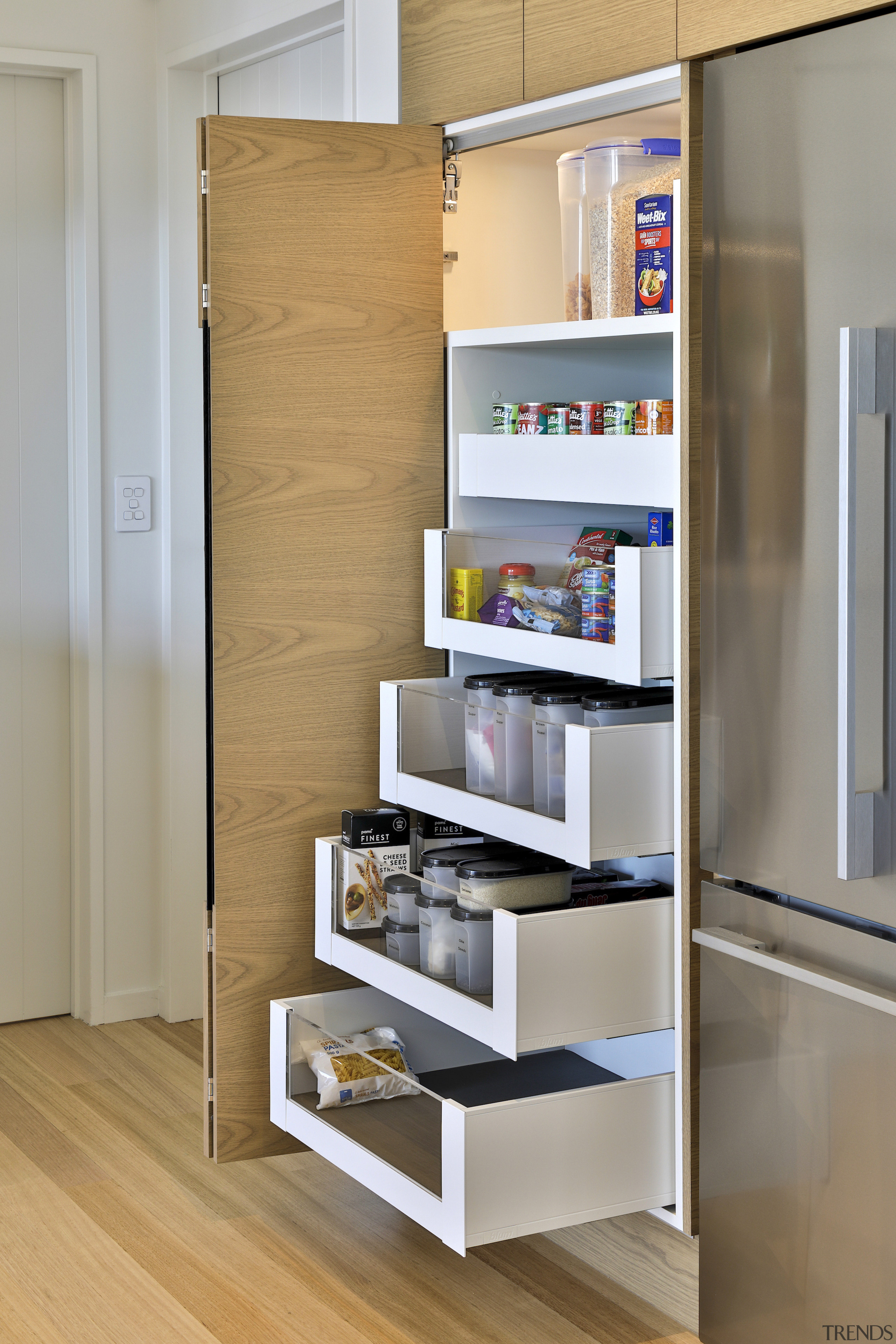 Staggered drawers in the in-cabinet pantry can all 