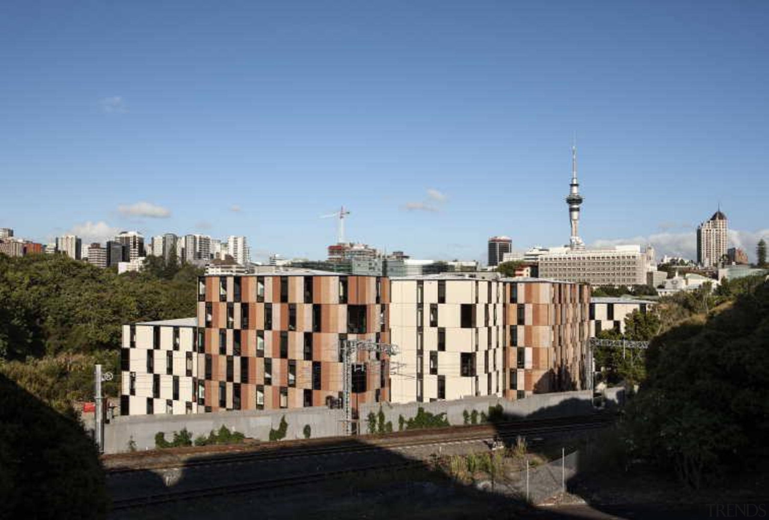 Carlaw Park Student Village in Auckland accommodates students building, city, metropolis, metropolitan area, neighbourhood, residential area, sky, skyline, urban area, teal