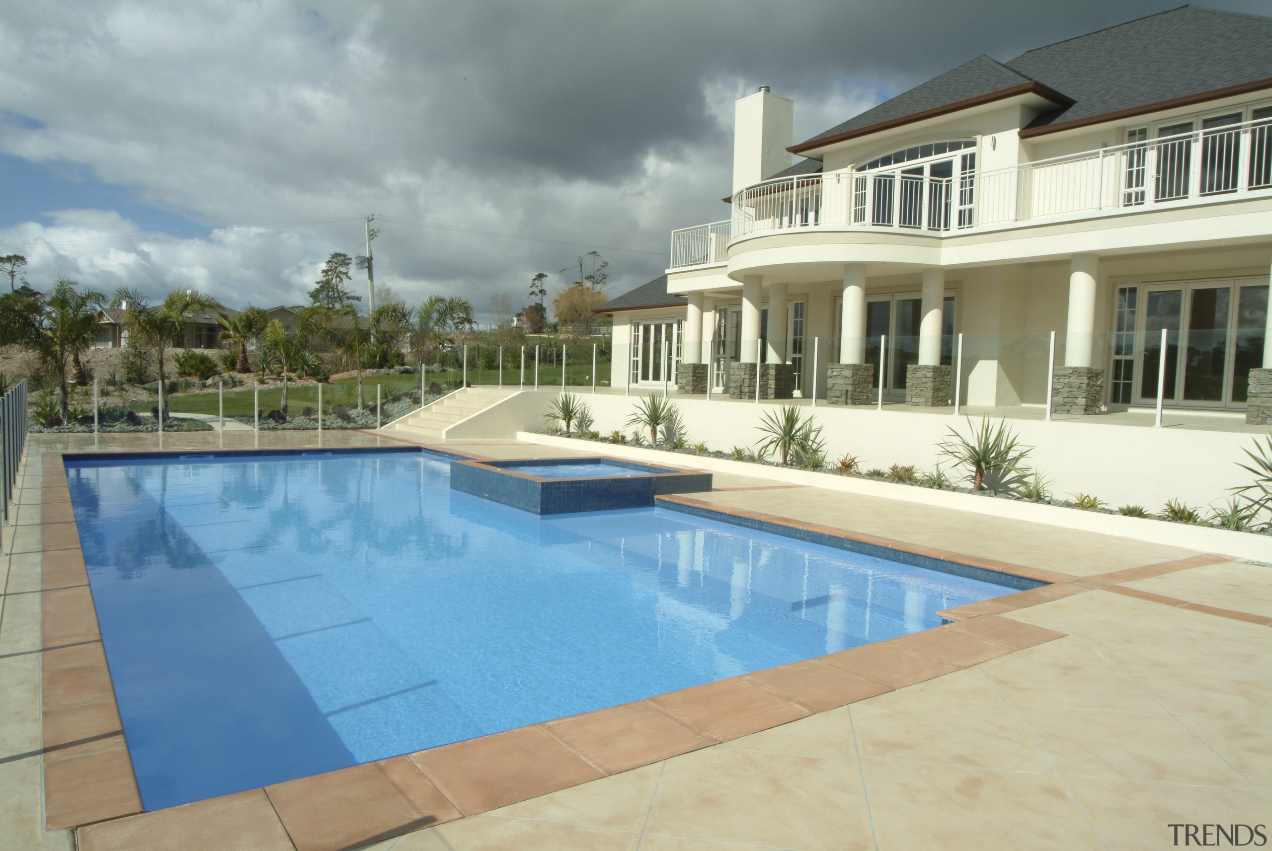 A view of a pool by Mayfair Pools. apartment, backyard, estate, home, house, leisure, property, real estate, residential area, swimming pool, villa, gray