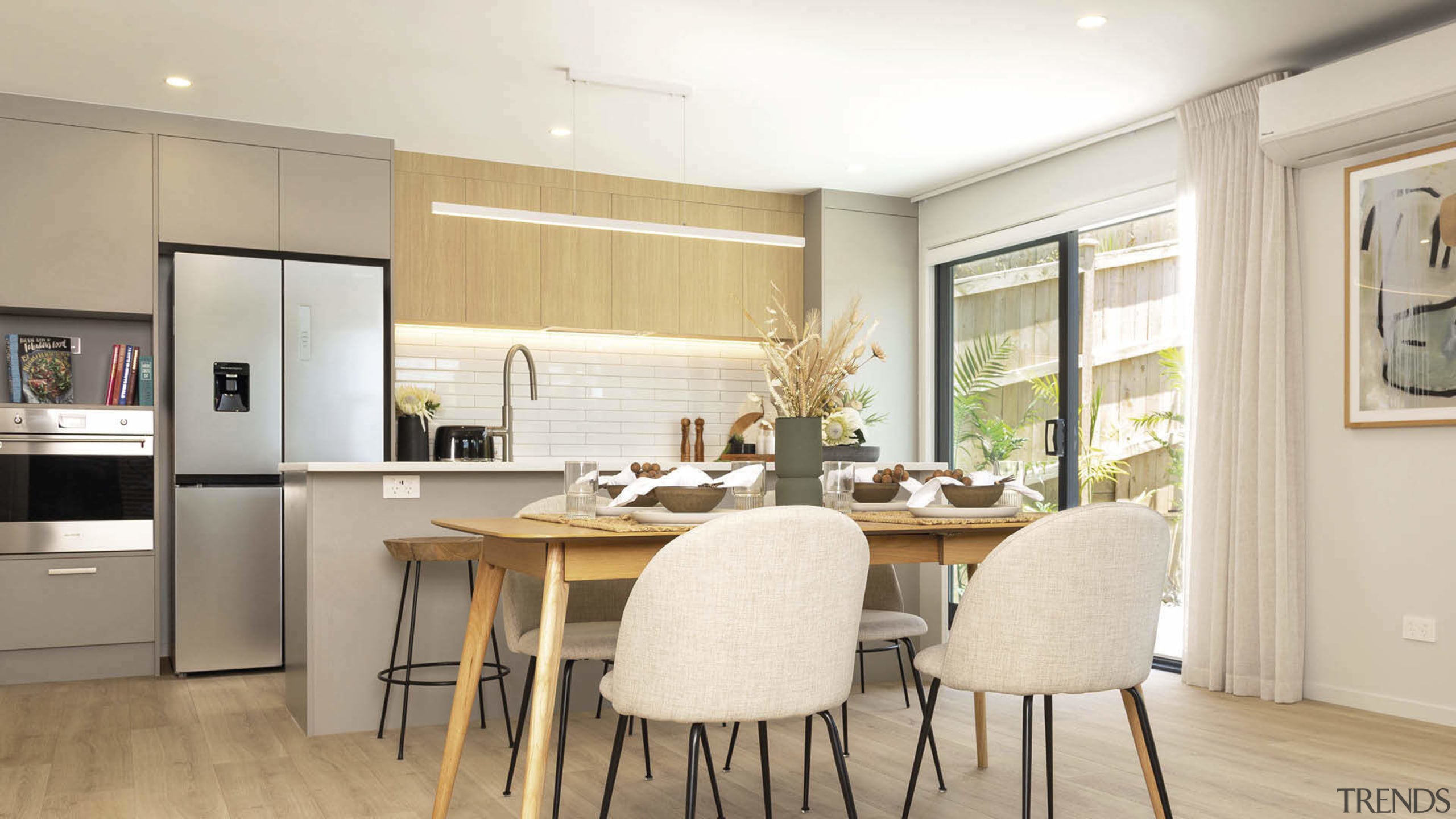 The clean-lined, highly functional kitchen is next to 