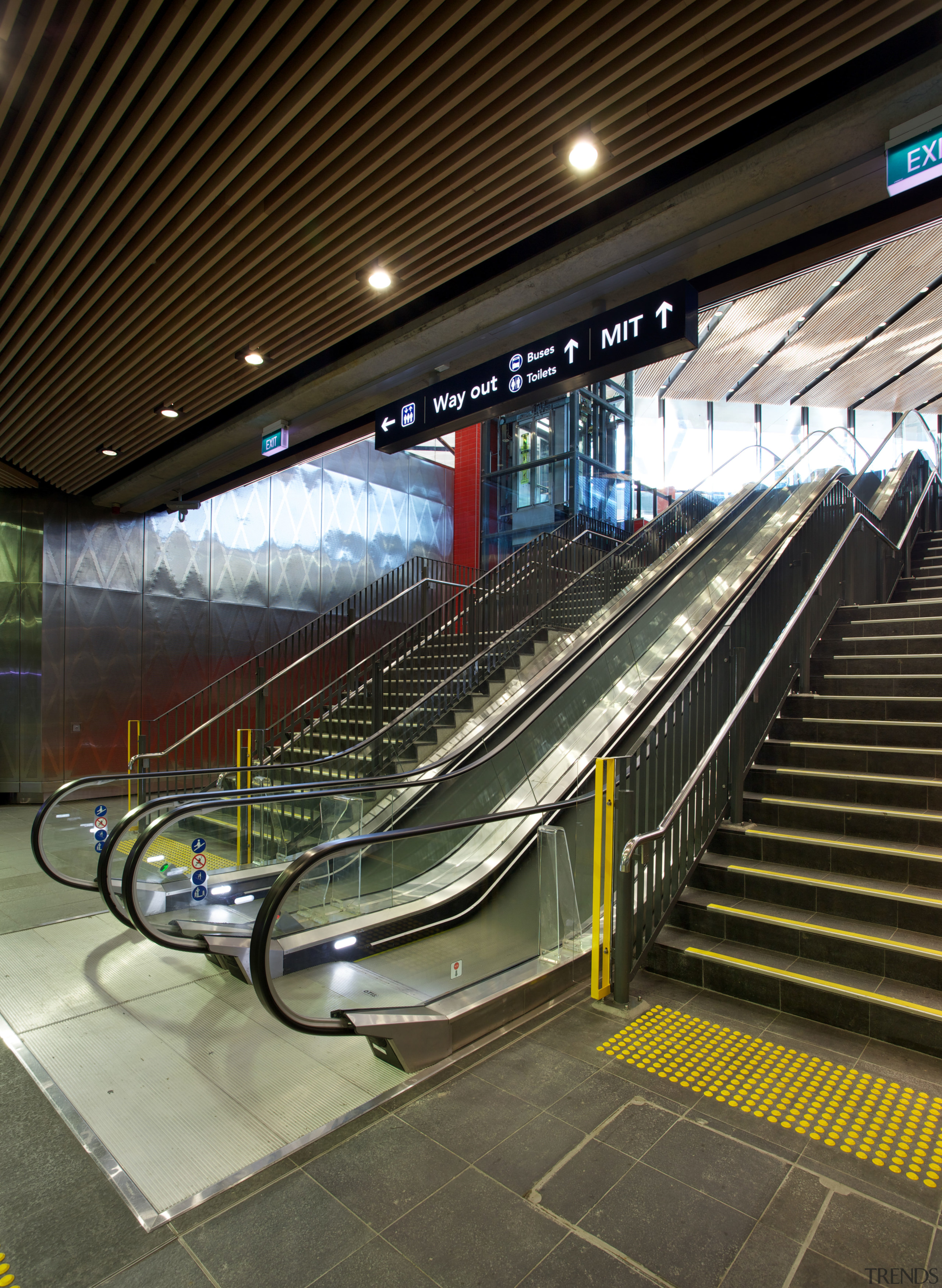 Otis supplied and installed two escalators, for the escalator, metro station, metropolitan area, public transport, train station, brown, black