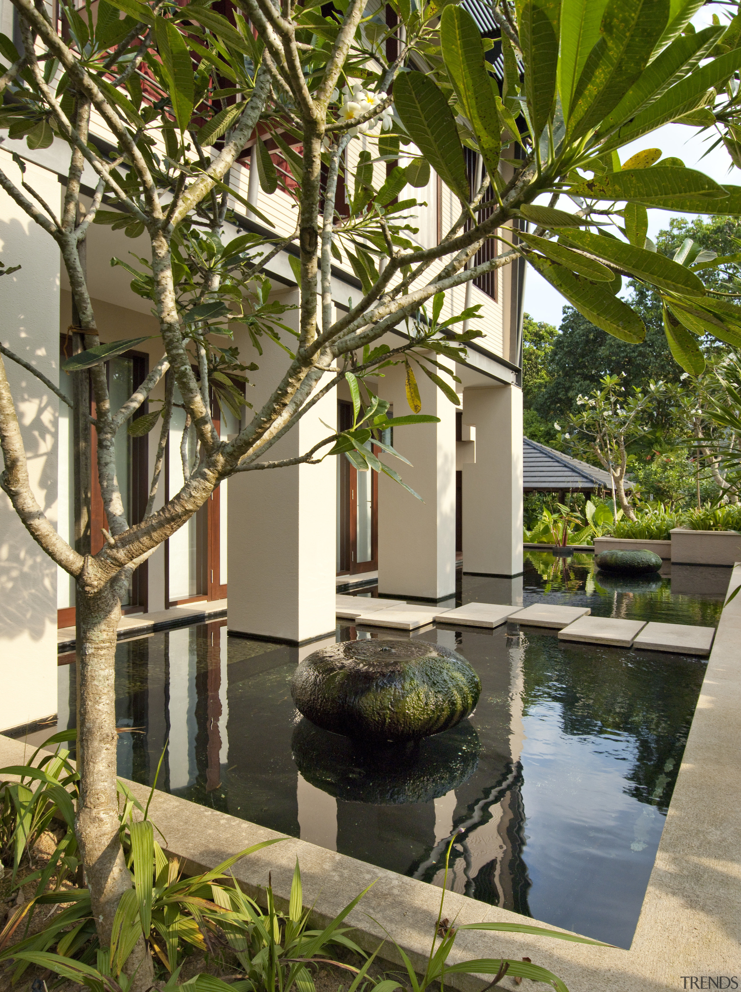 Exterior view which features a fish pond. - arecales, courtyard, estate, home, house, outdoor structure, palm tree, plant, property, real estate, reflecting pool, resort, tree, villa, brown