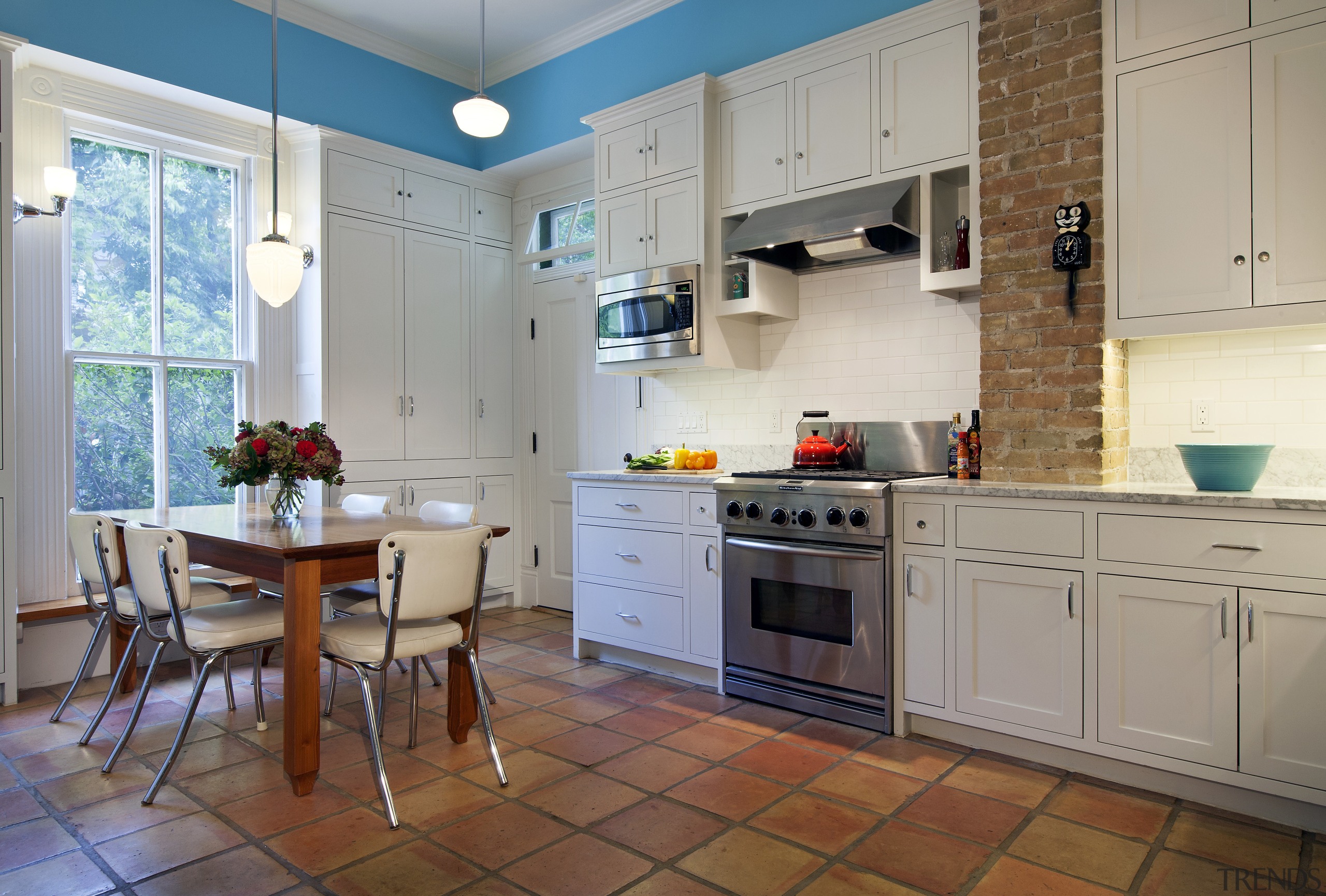 Shaker-style doors and crown mouldings enhance the traditional cabinetry, countertop, cuisine classique, floor, home, interior design, kitchen, property, real estate, room, gray