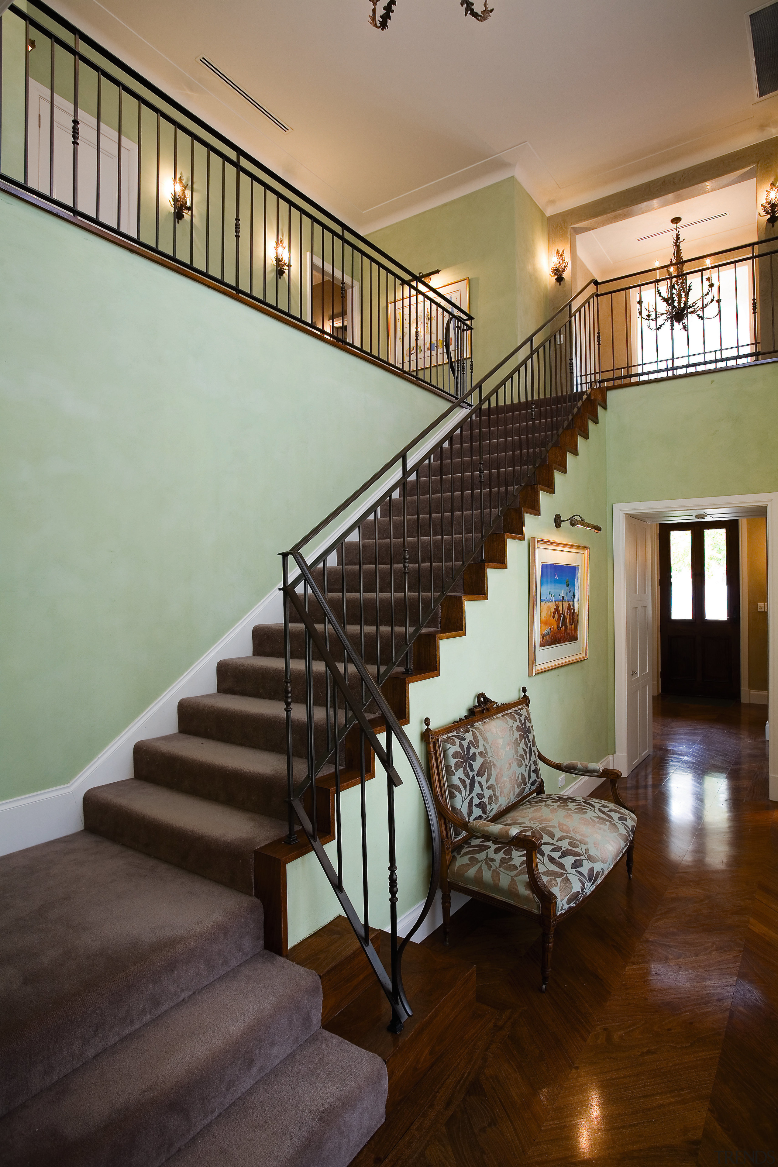 A view of the staircase. wooden floors and architecture, baluster, ceiling, daylighting, estate, floor, flooring, handrail, hardwood, home, house, interior design, living room, real estate, stairs, wall, window, wood, gray, brown