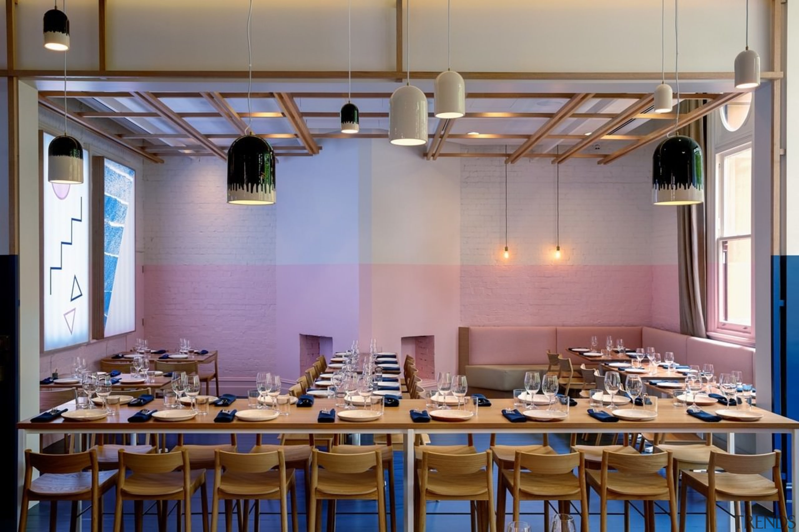 Pastel pinks compliment the blue floors. Architect: 