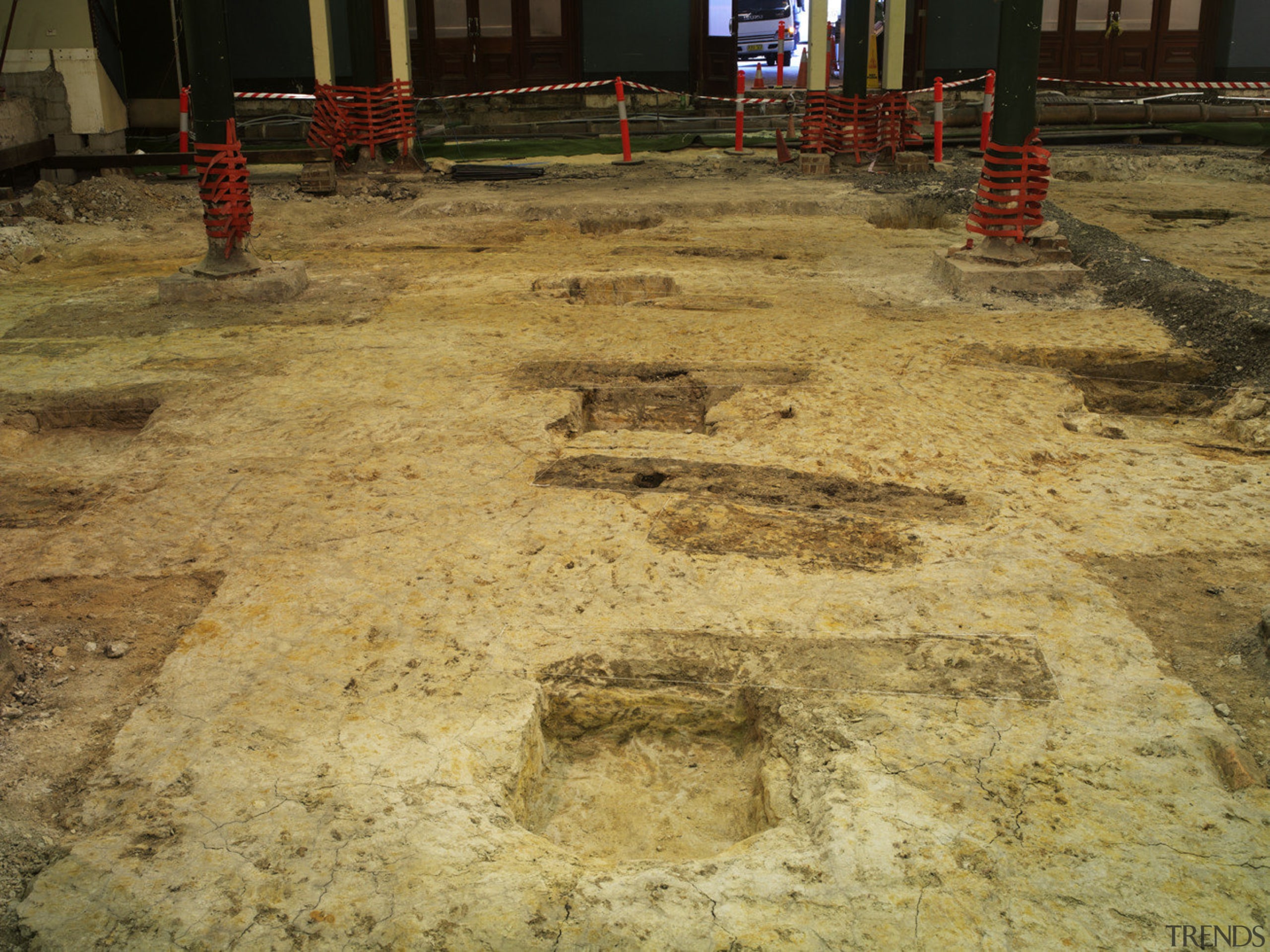 View of the renovated Sydney town hall featuring archaeological site, soil, brown, orange