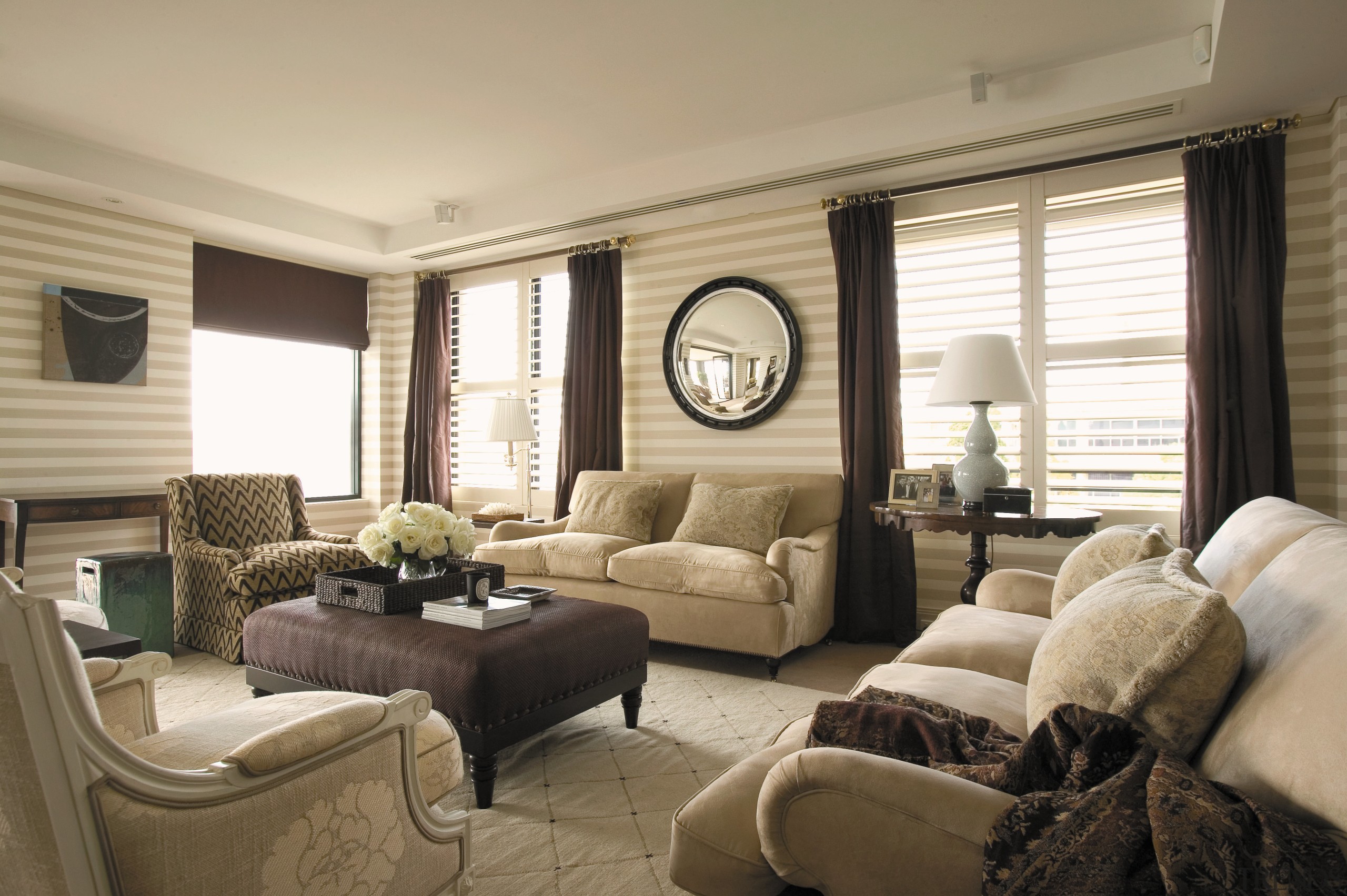 view of the living room featuring white cream home, interior design, living room, real estate, room, window, window covering, window treatment, gray, brown