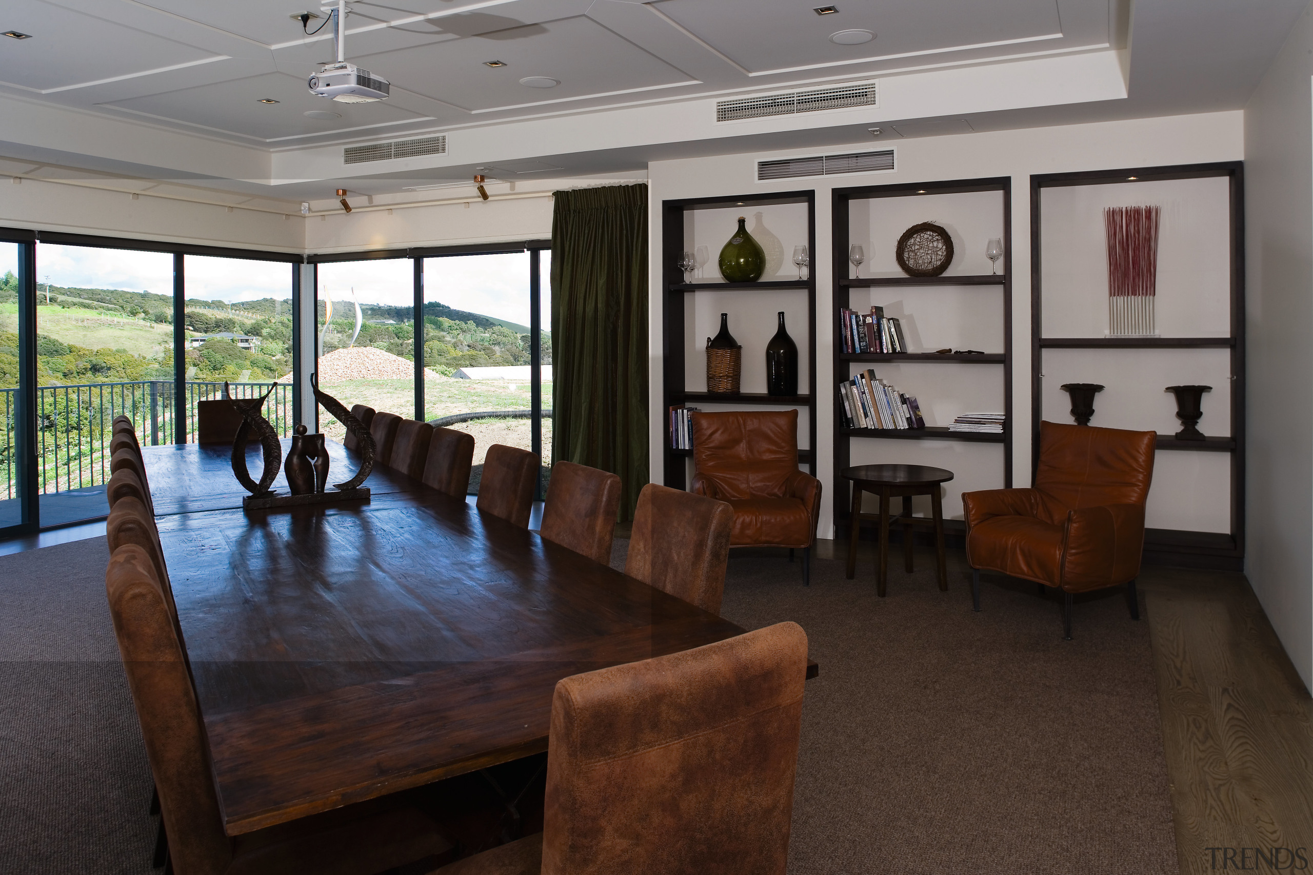 The boardroom, offices and production facilities are contained interior design, real estate, table, black, gray