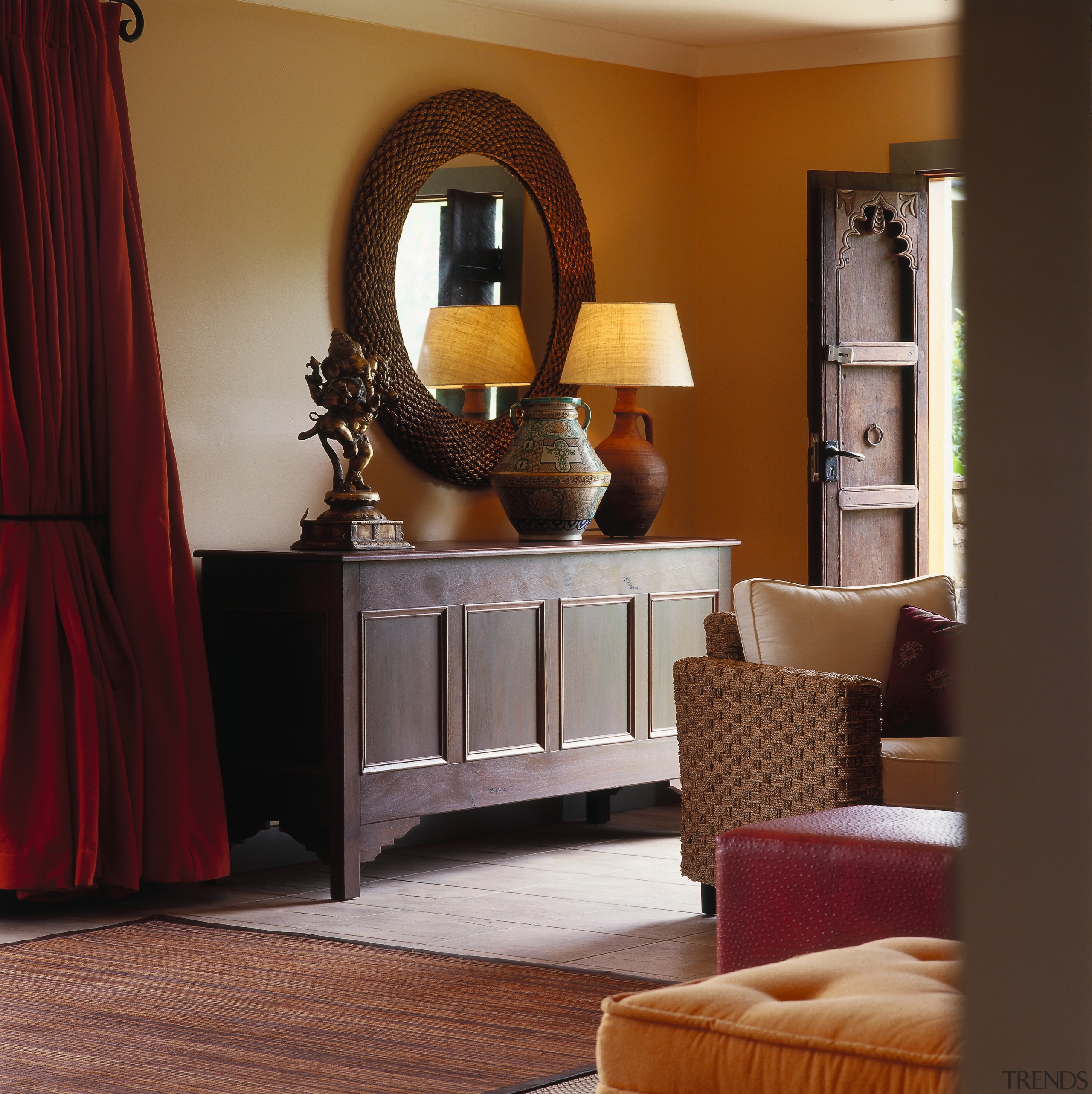 View of this living area - View of cabinetry, chest of drawers, floor, flooring, furniture, hardwood, home, interior design, living room, room, table, red, brown