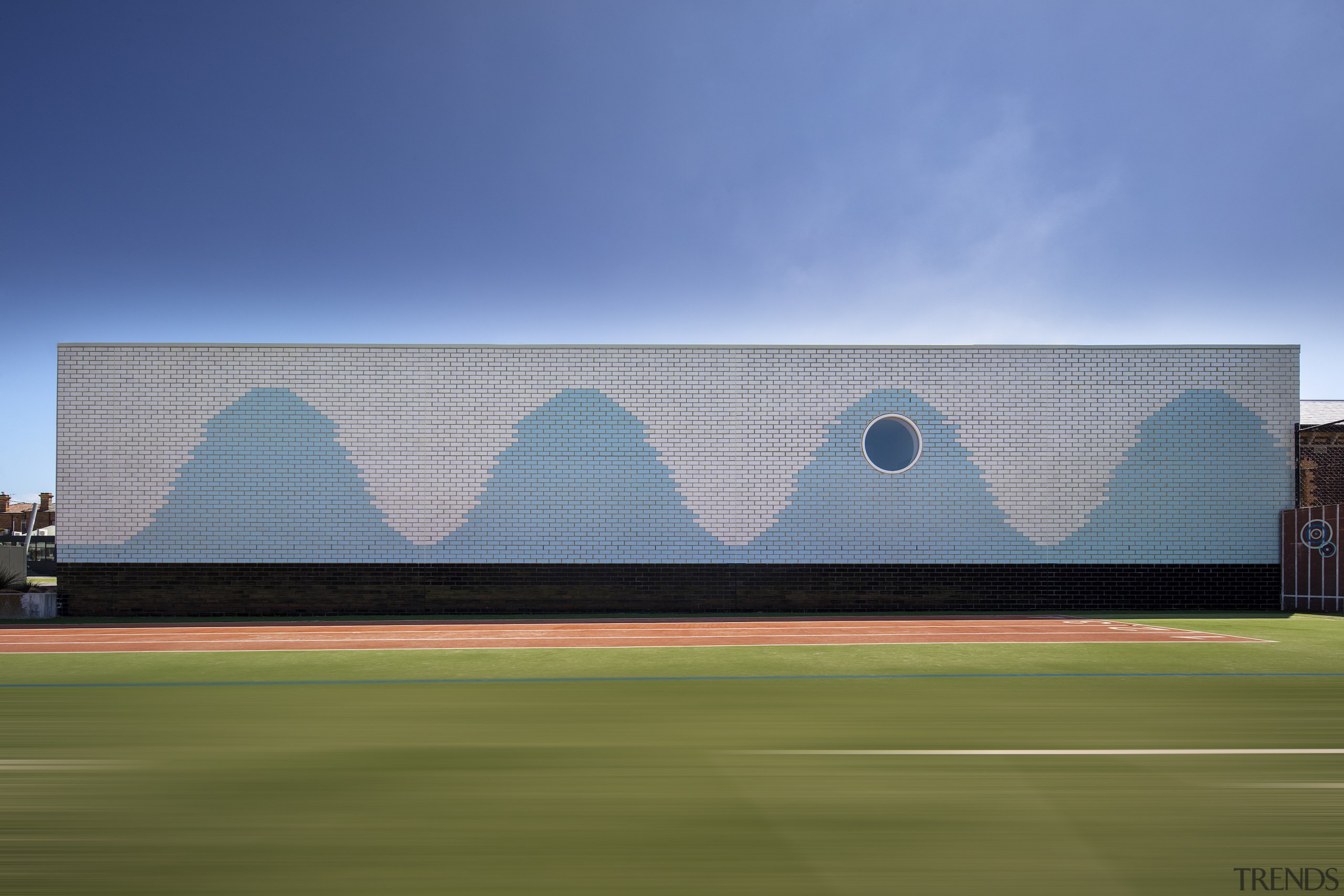 The distinctive waving wall is on the north 