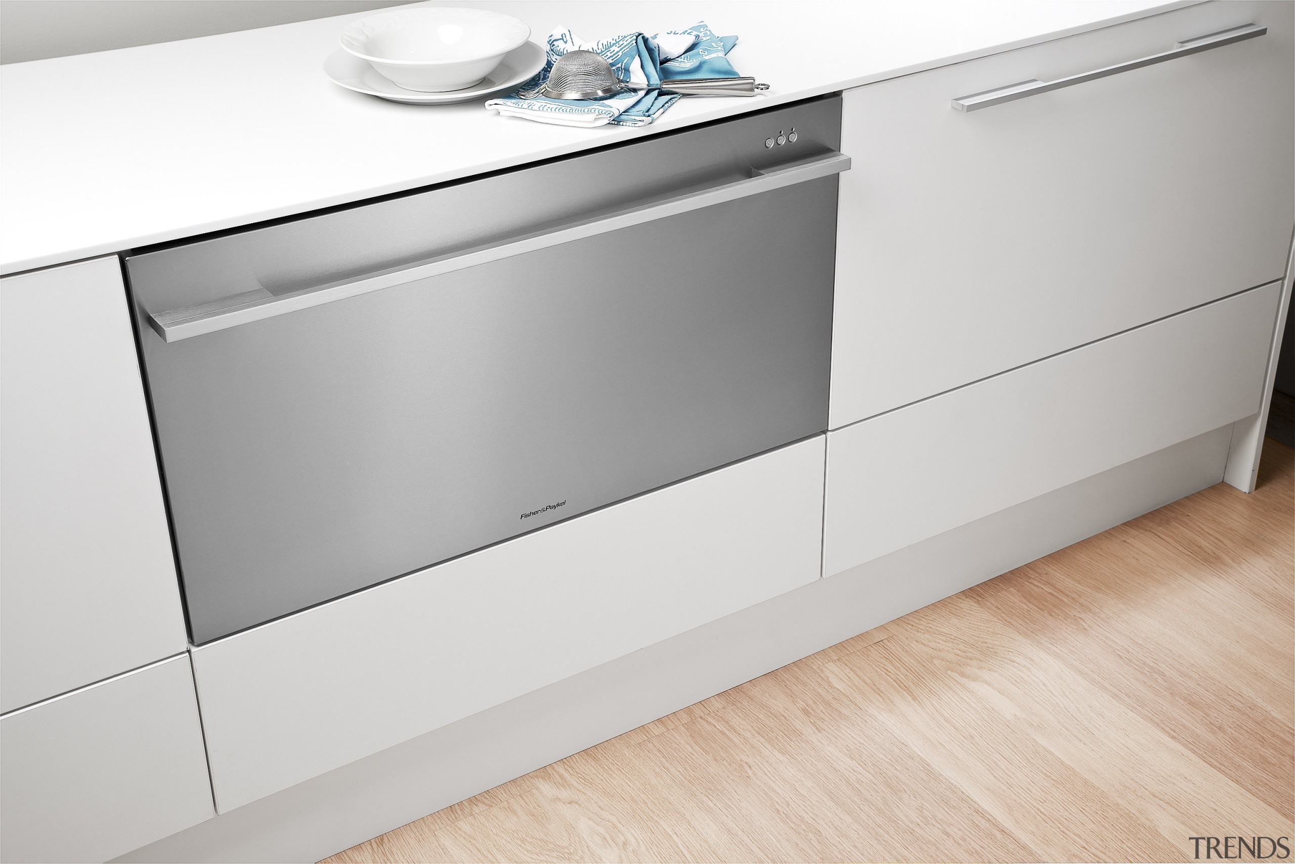 View of kitchen featuring appliances from Fisher &amp; angle, chest of drawers, countertop, drawer, floor, furniture, home appliance, kitchen, major appliance, product, product design, sideboard, white