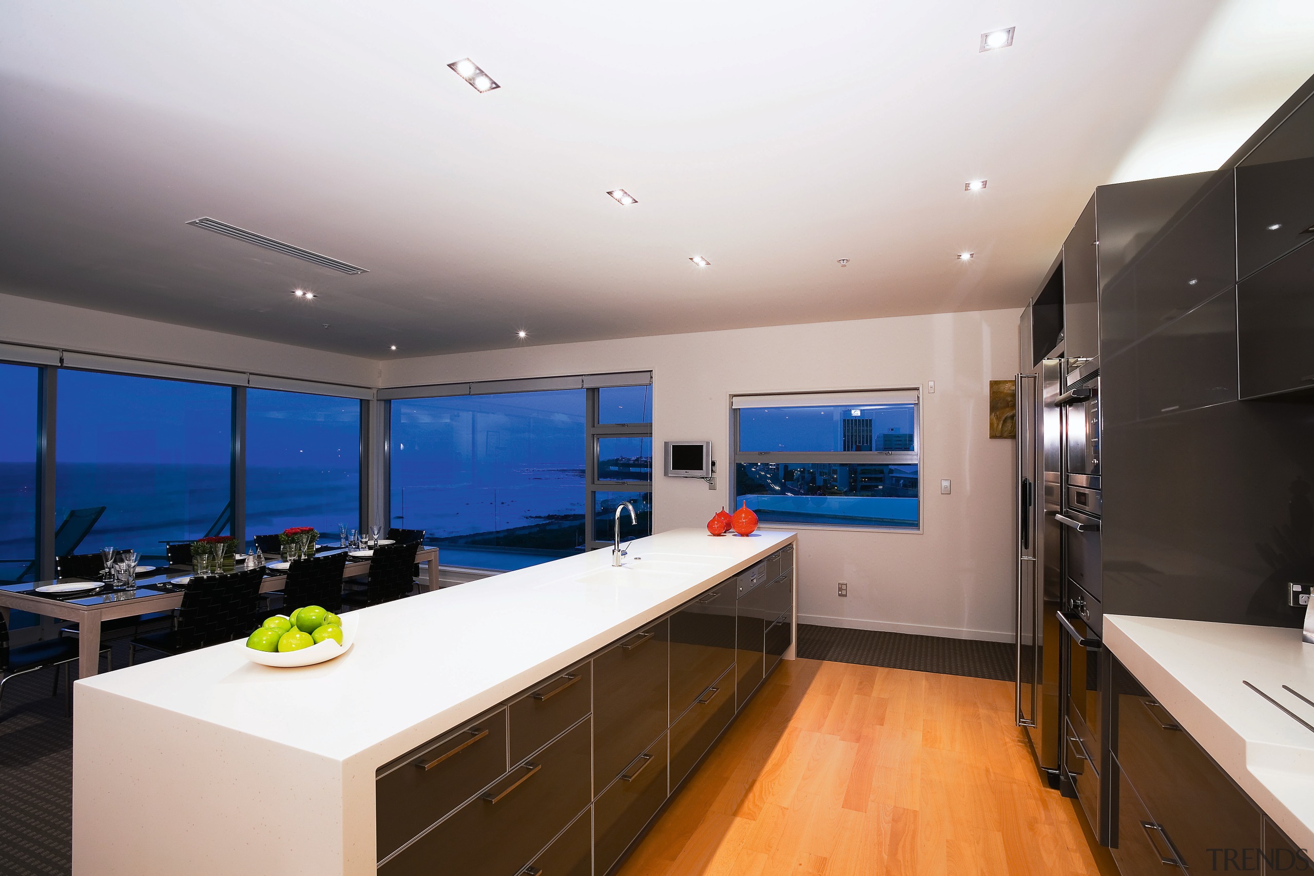 A view of a kitchen, wooden flooring, lights, countertop, interior design, kitchen, real estate, room, gray