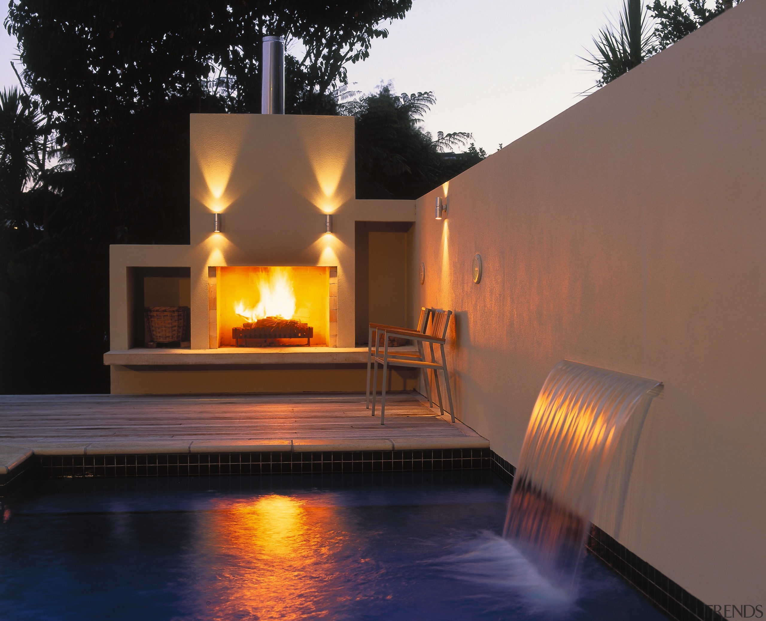 view of the outdoor entertainment area and mayfair fireplace, heat, landscape lighting, lighting, reflection, water, brown, black